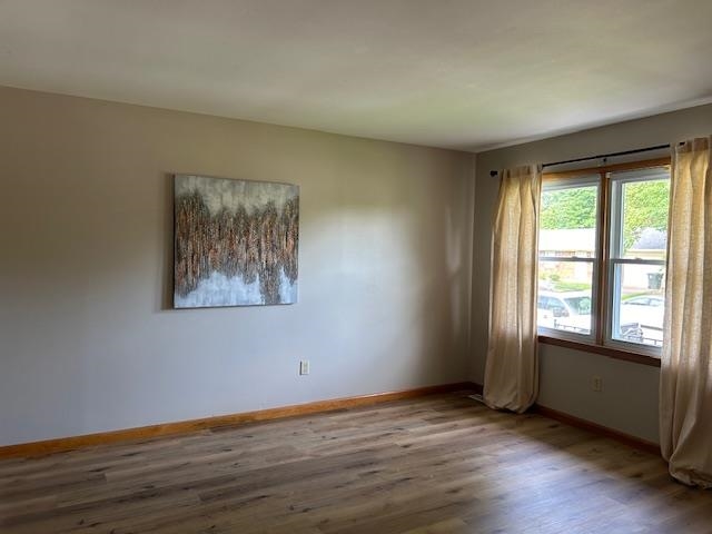Spacious living room with new LVT flooring and paint.  Double window allows a lot of natural light.