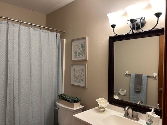Remodeled bathroom has new vanity, top, mirror, light and plumbing fixtures, and LVT flooring!
