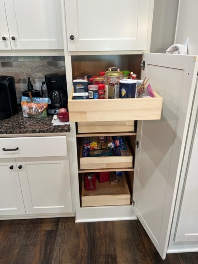 PHILS CUSTOM CABINETS WITH ROLL OUT TRAYS.