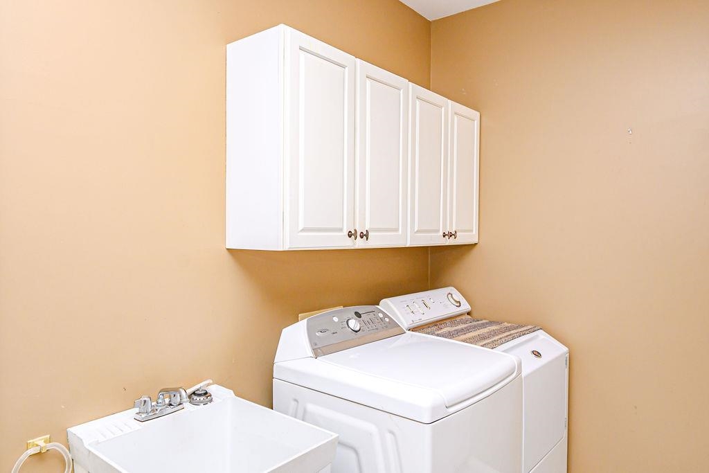The Utility room is just off the Kitchen with access to the Garage.