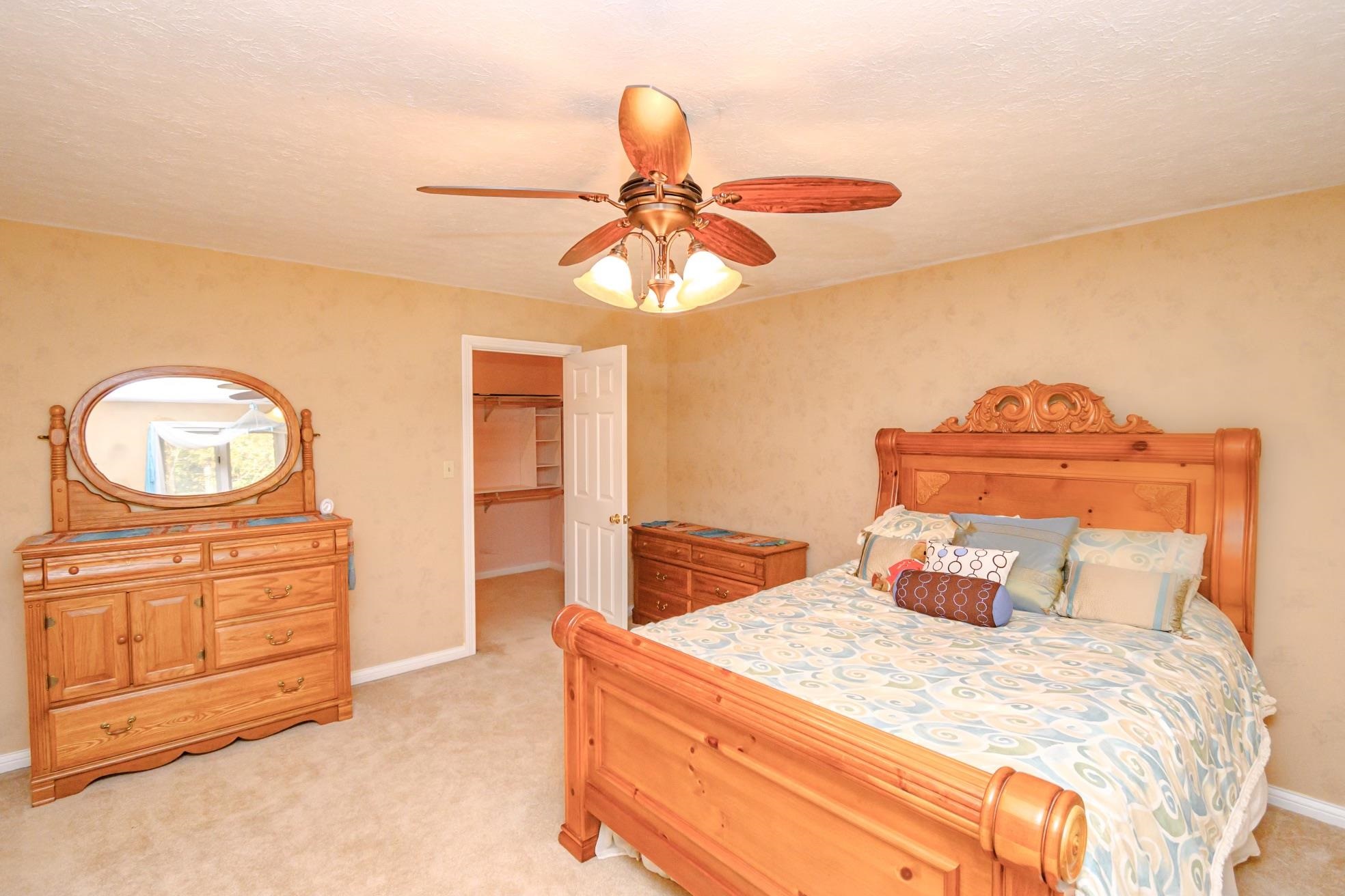 Large Bedroom upper level with large walk-in closet  Windows look out to the north side of property