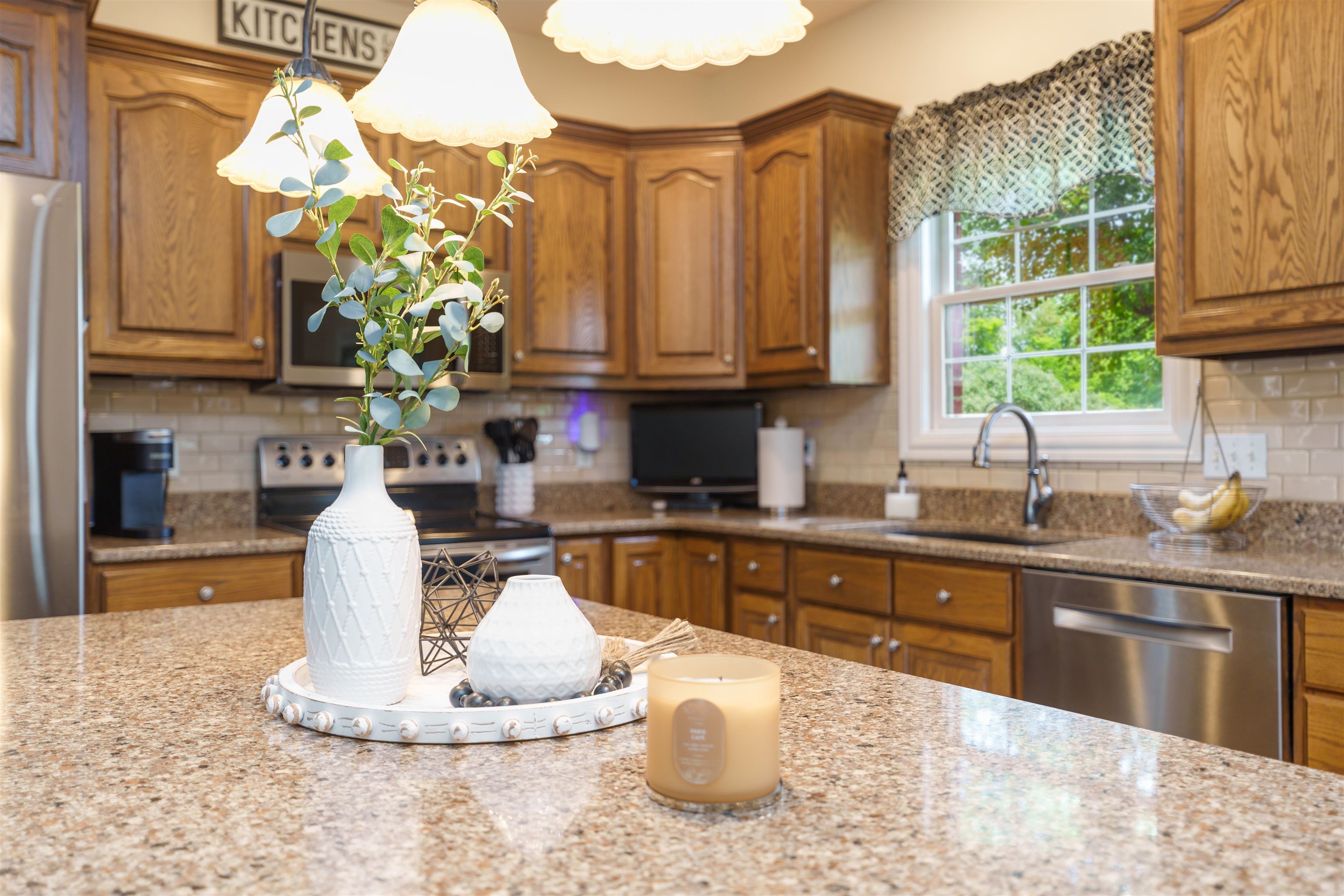 Granite, backsplash, island/bar, and 2 pantries.
