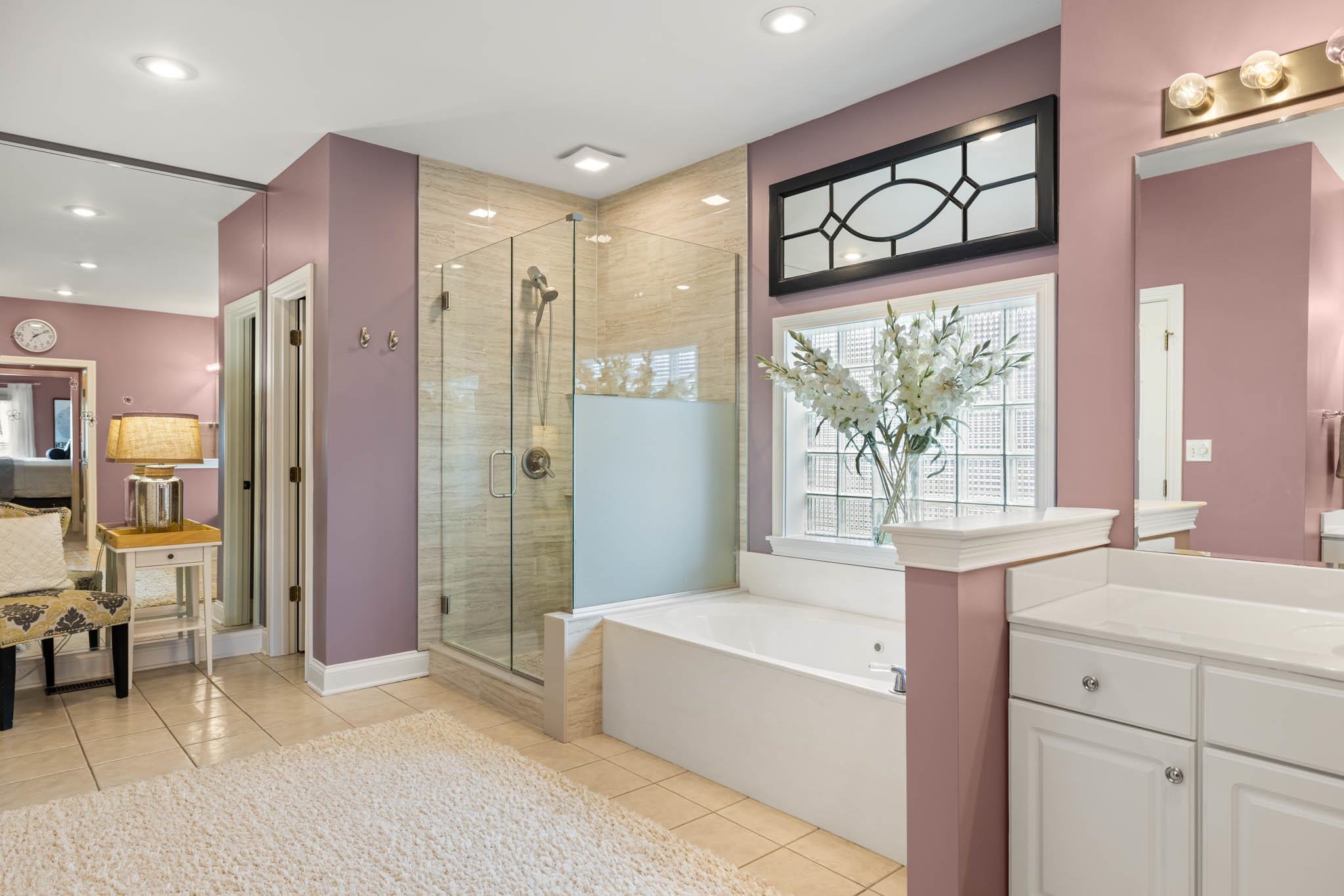 New tiled shower, jetted tub, double vanities, private lavatory, and two additional closets