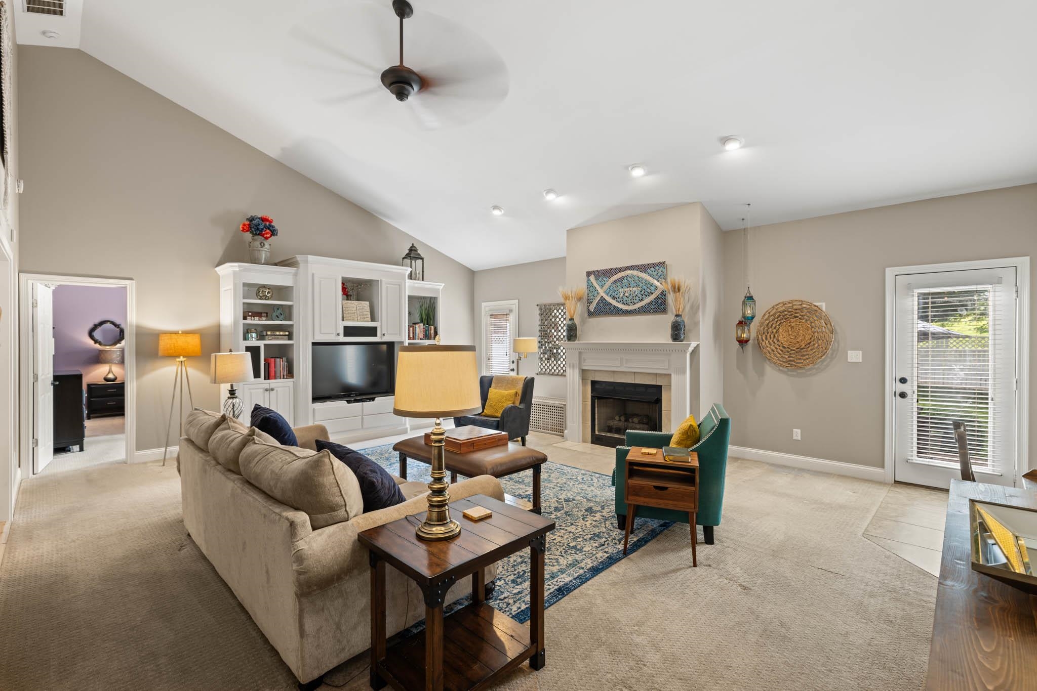 Gas logs, built-in cabinets, vaulted ceiling, 2 exits to private patio