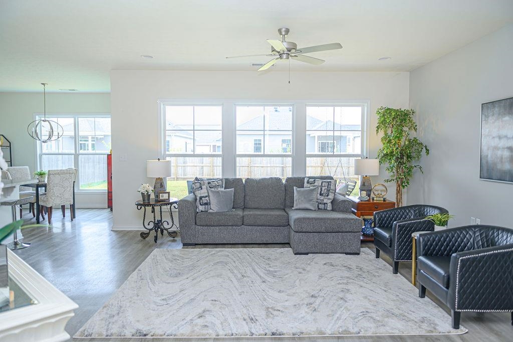 Spacious great room has an abundance of windows!  Love the natural light.