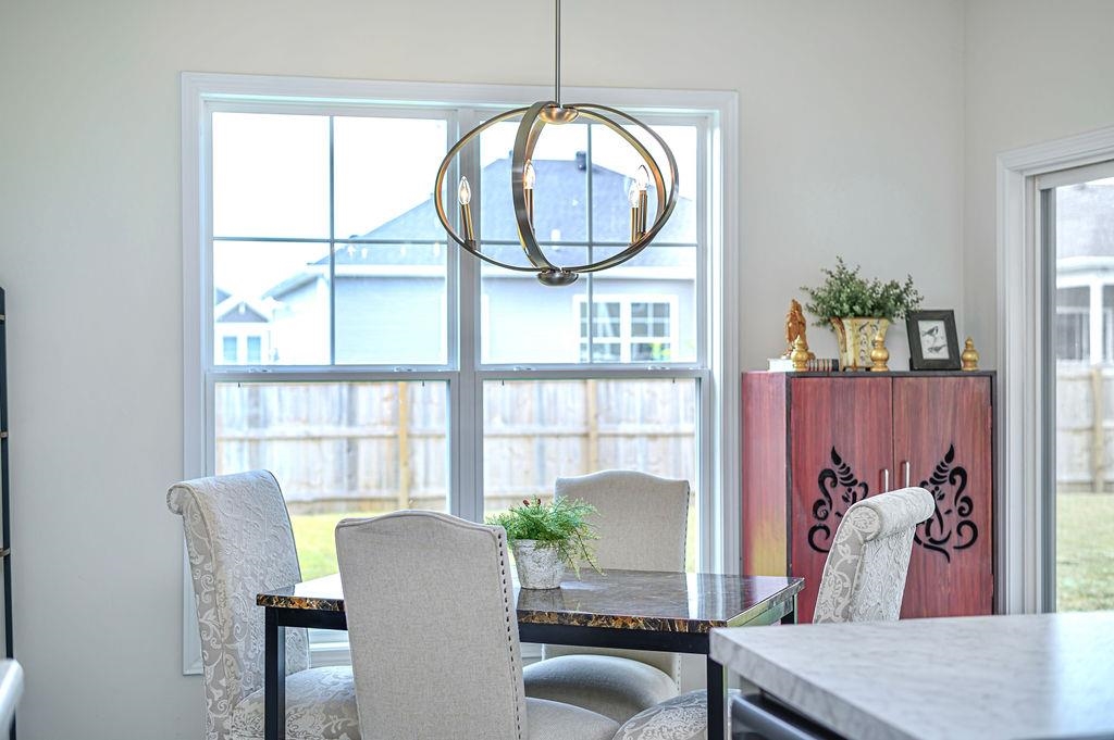Large dining area has a gorgeous chandelier!