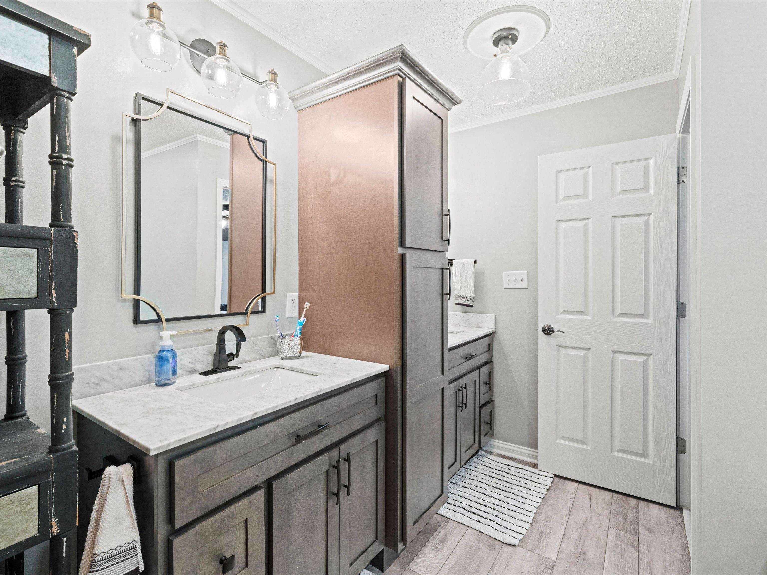 Double vanity; loads of storage; soaking tub; separate walk-in shower