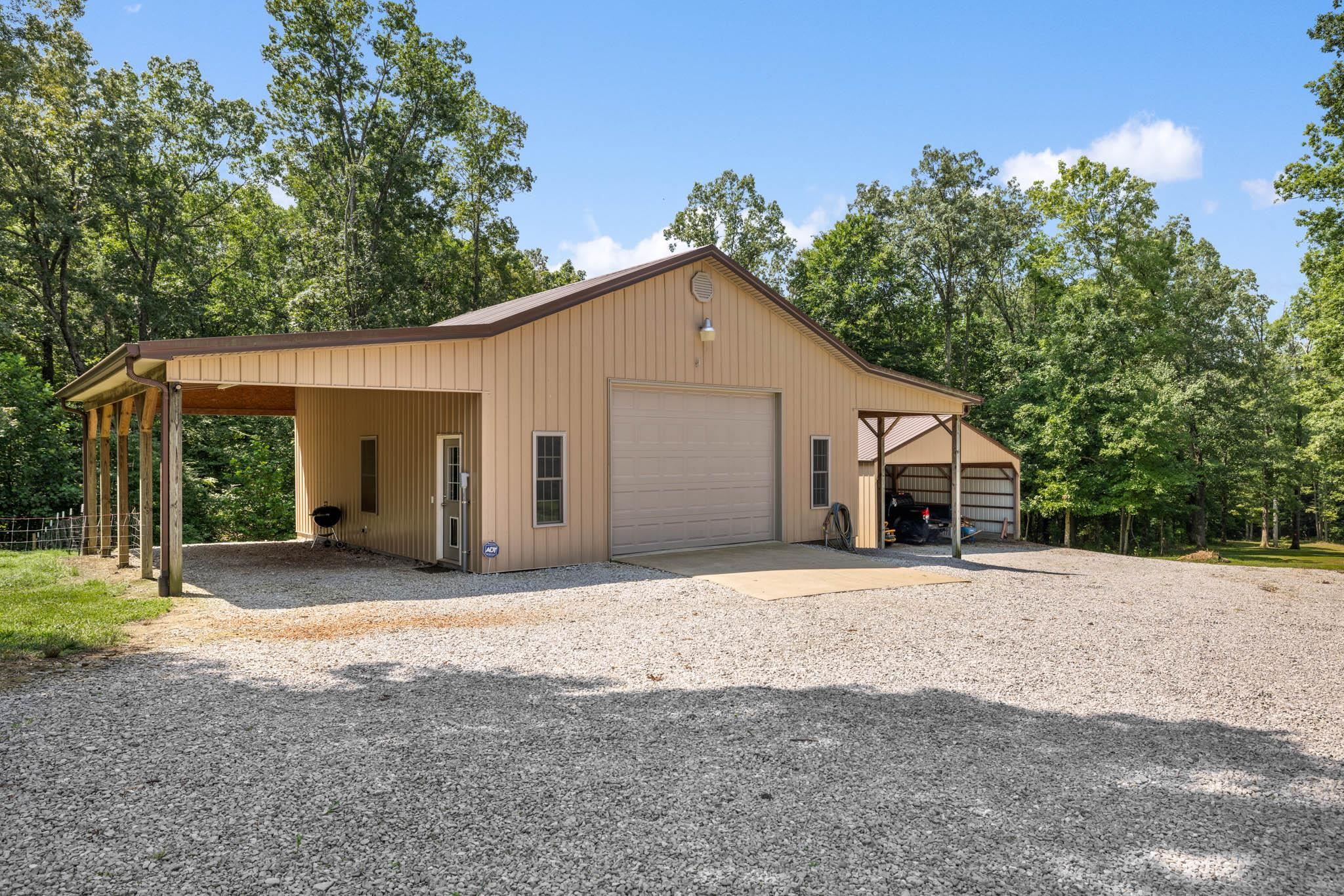 15' wide lean-to, heat, concrete, electric, utility sink, insulated 14' wide x 10' tall garage door