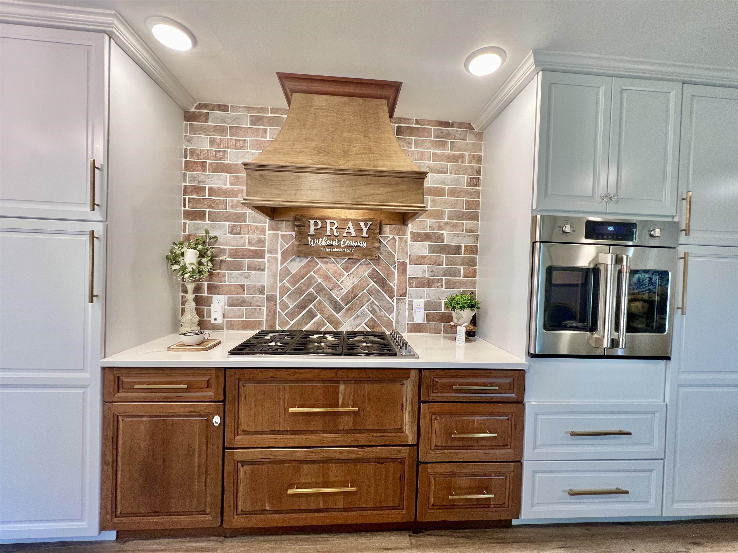 The oven is commercially built-in with surrounding custom cabinets to provide ample storage.