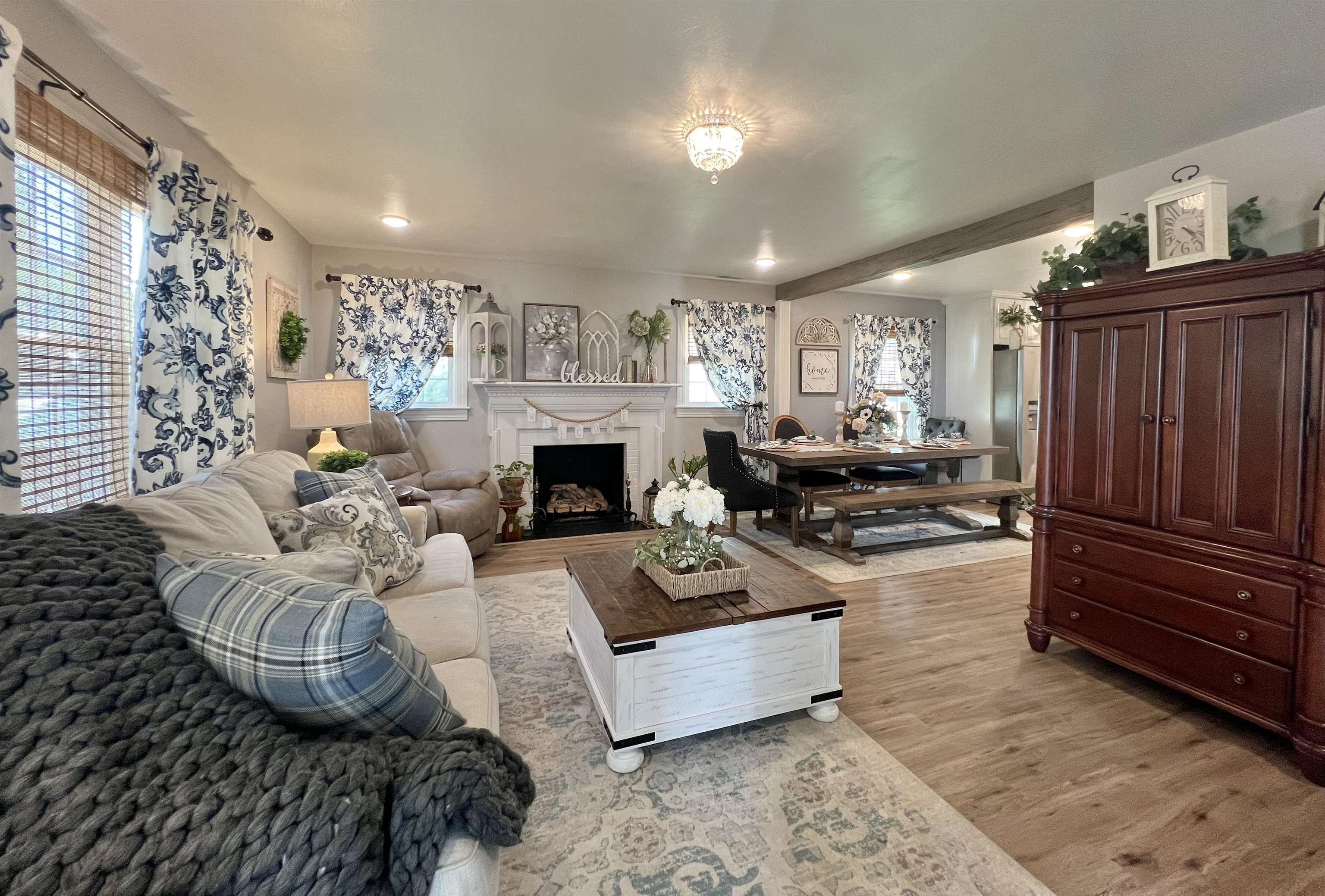 Open-concept living space with functional gas fireplace.