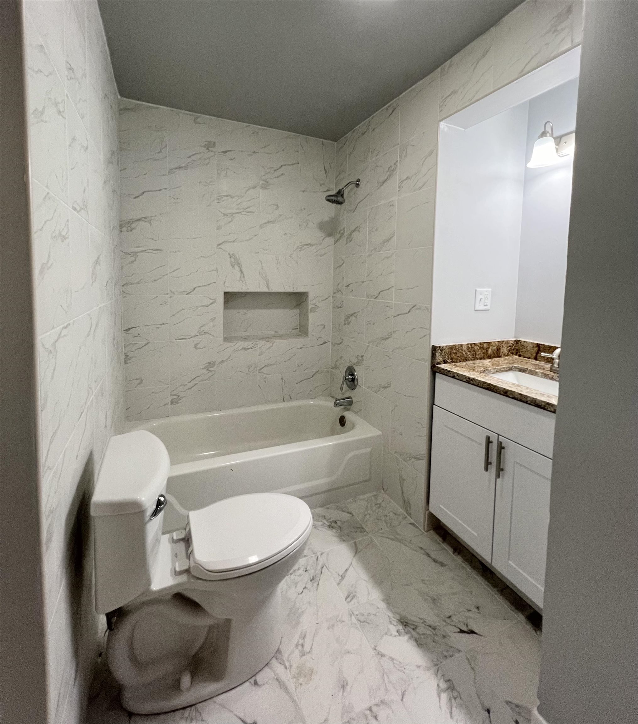 Tiles floors and tub surround, new toilet, vanity and fixtures.  Washer/dryer hookup.