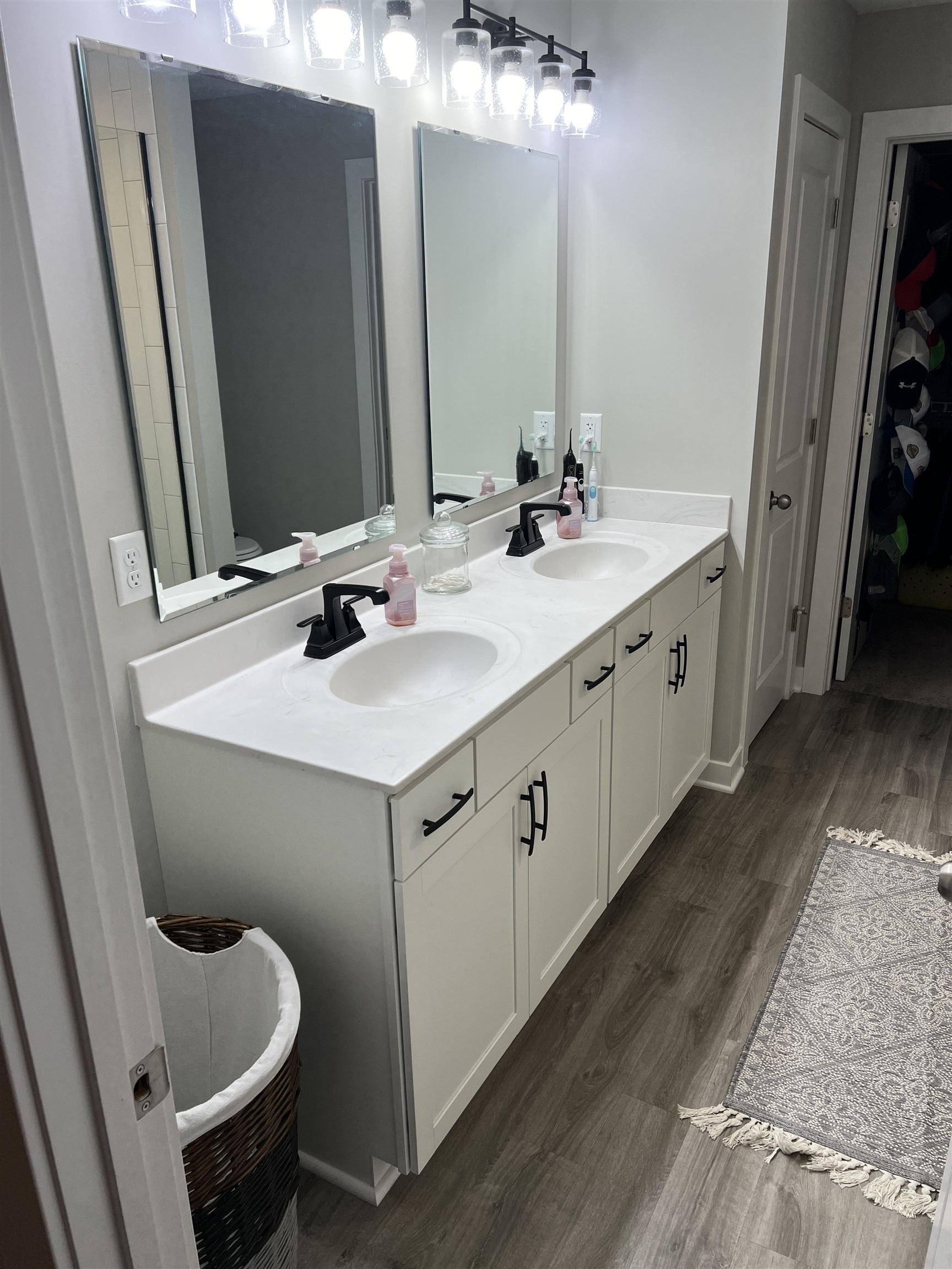 Master bath with upgraded double vanity sink and walk-in tiled shower.