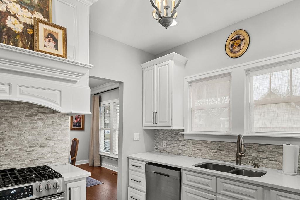 Check out the custom range hood!  Stunning!