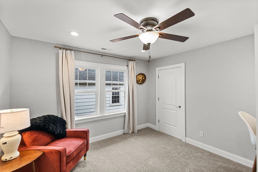 Upstairs bedroom currently used as an office features two large closets for storage.