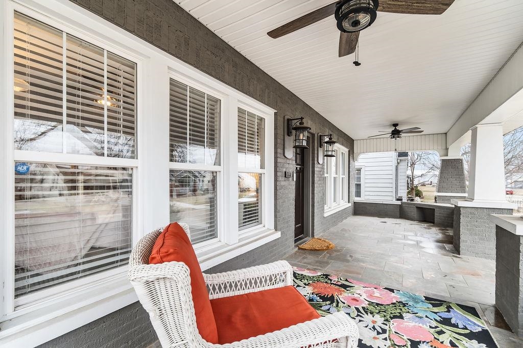 Front porch features tiled floor and ceiling fans.  It's like having another room!
