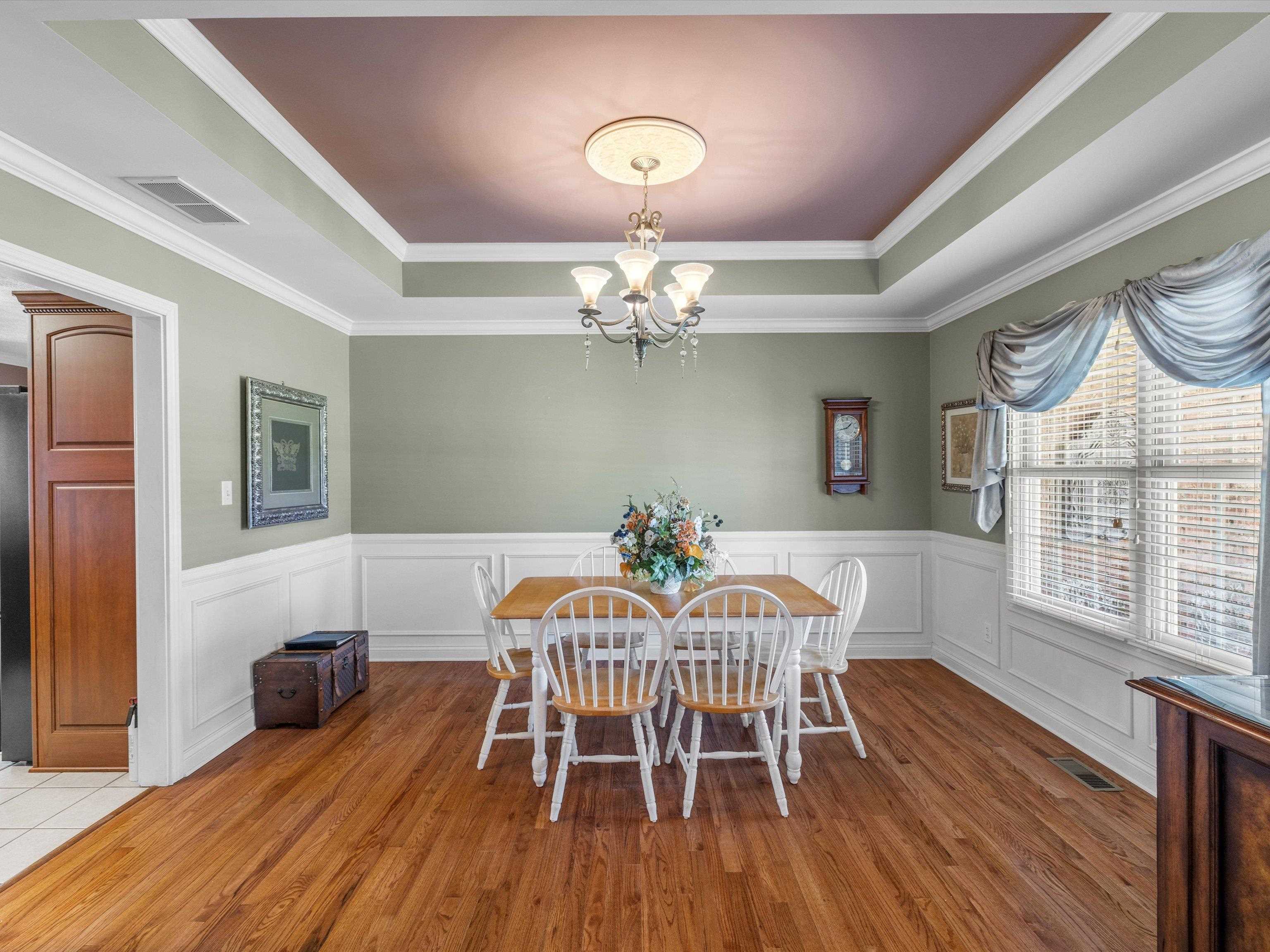 To the right of the foyer, leads to the kitchen.