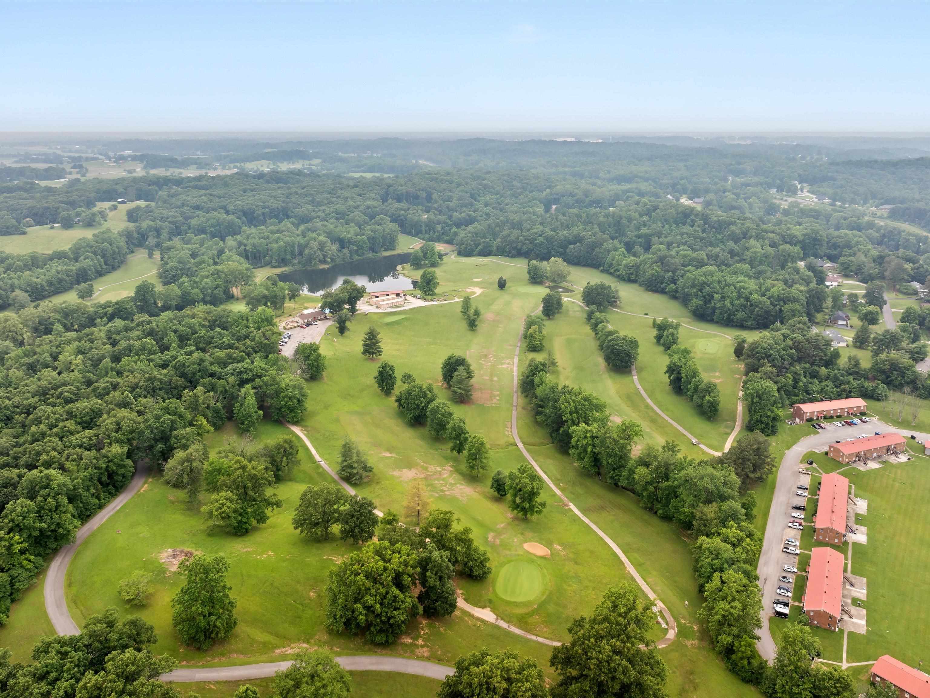 Property is located beside the golf course with a trail to #5 hole.
