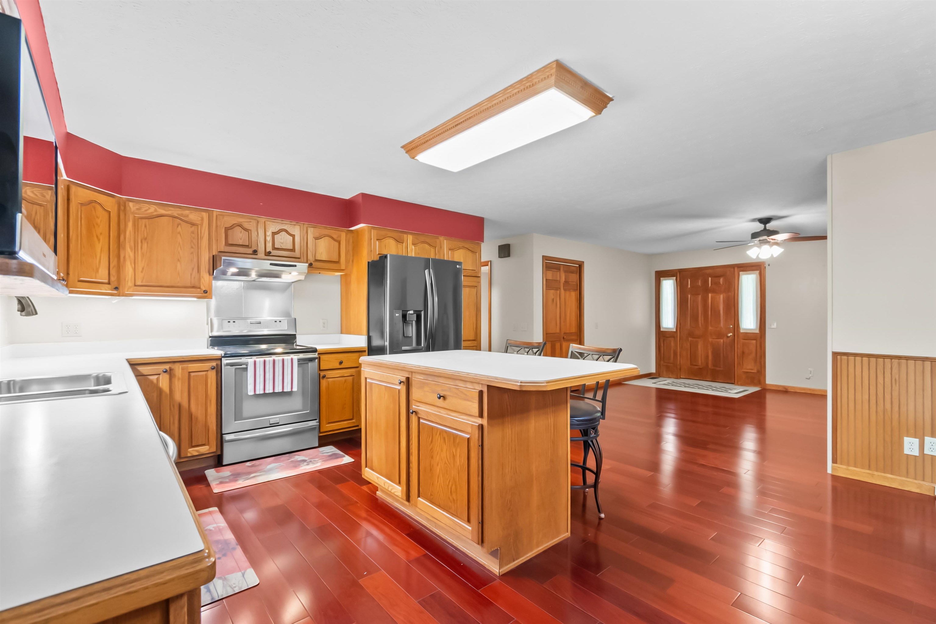 Island can comfortably sit 3 bar stools.  2 bar stools will remain with the home.