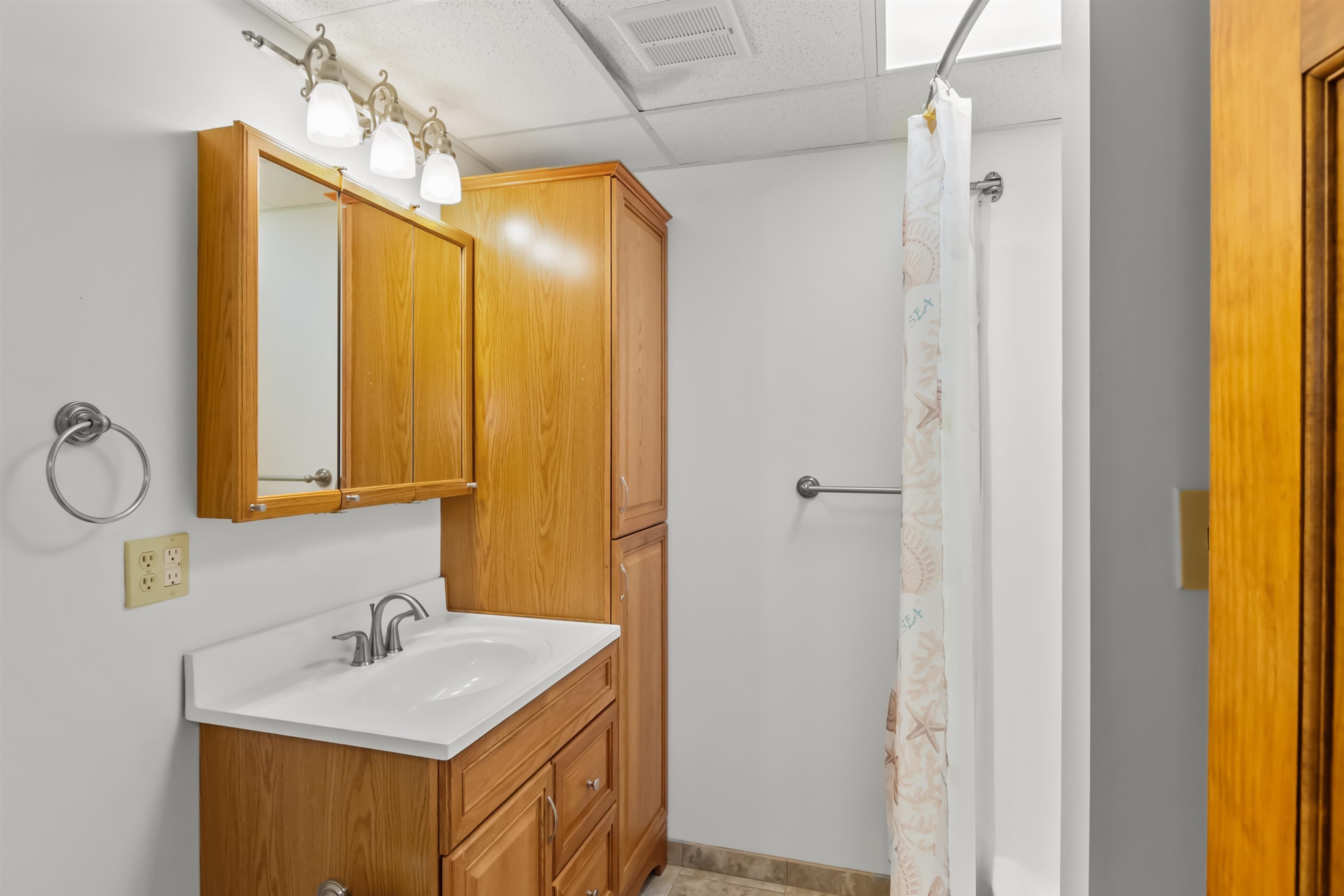 Full bath in the basement next to the room that could be a bedroom.