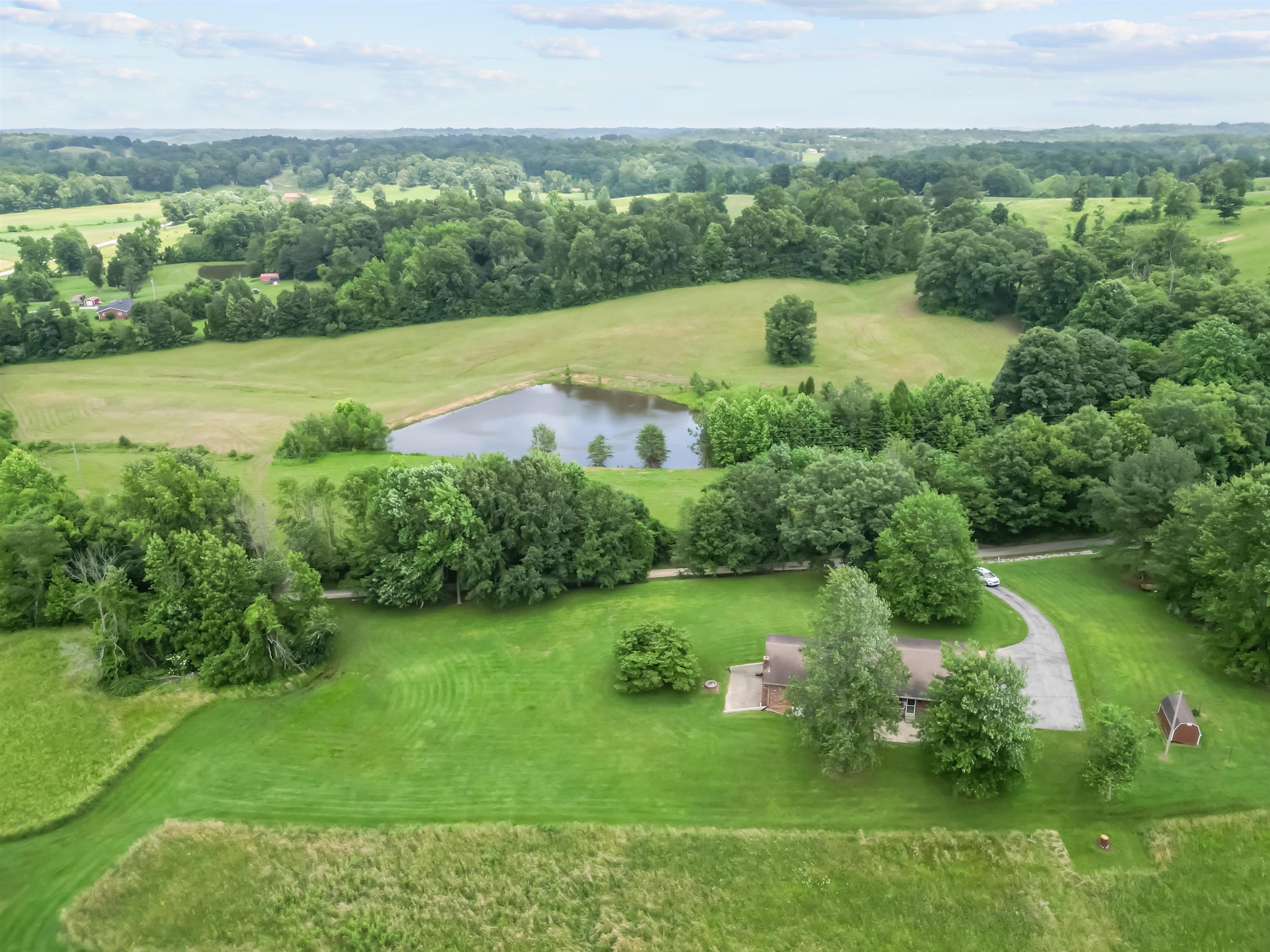 Overhead view across the road towards a neighbors lake.