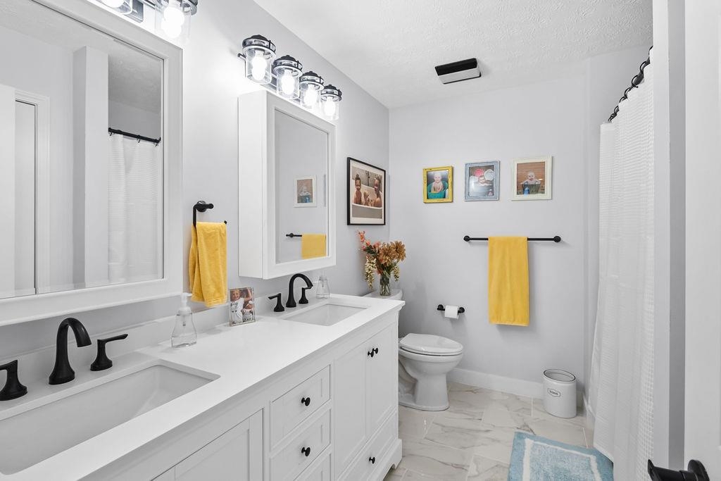This bath has been totally remodeled.  New double vanity, shower, flooring, fixtures, etc.