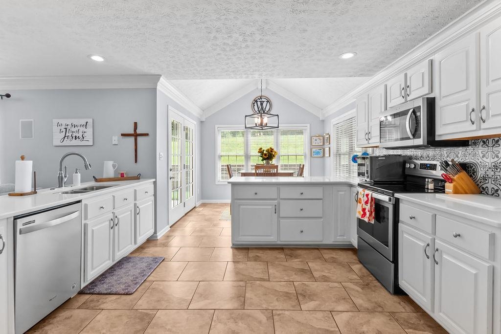 Spacious chef\'s kithen features an abundance of cabinets, Quartz countertops, stainless appliances