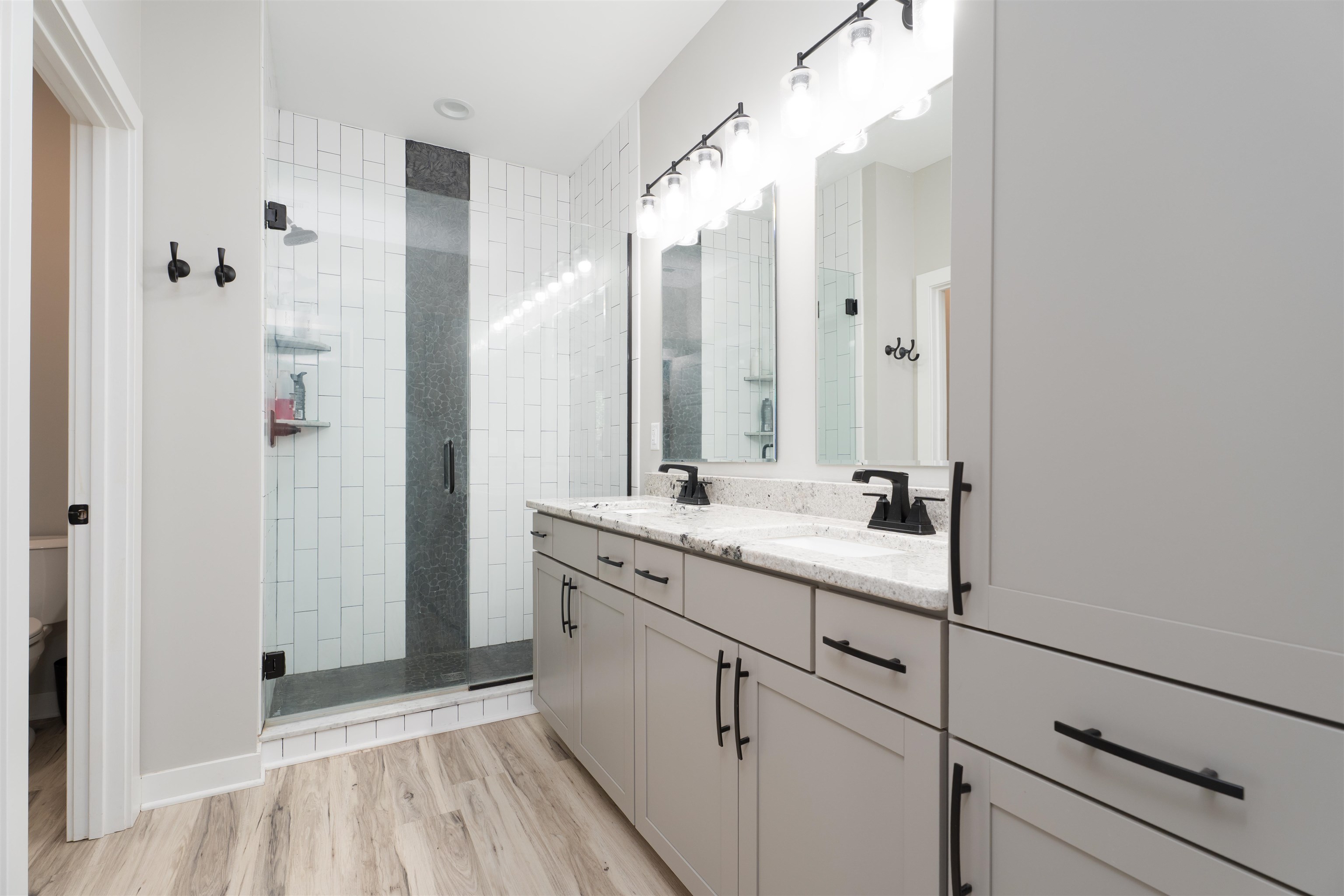 Tiled walk-in shower, walk-in closet, and private latrine