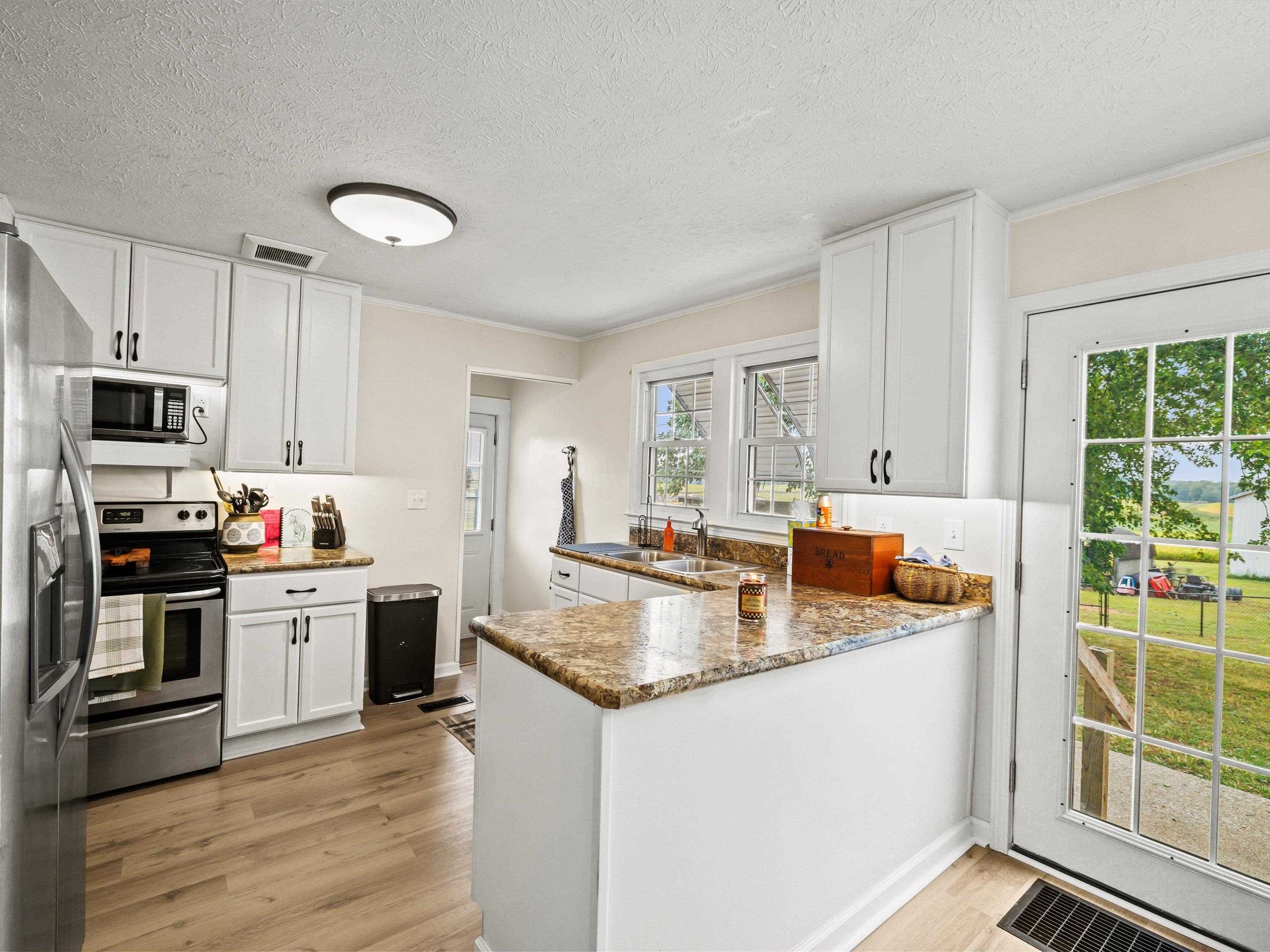 French doors to the spacious backyard