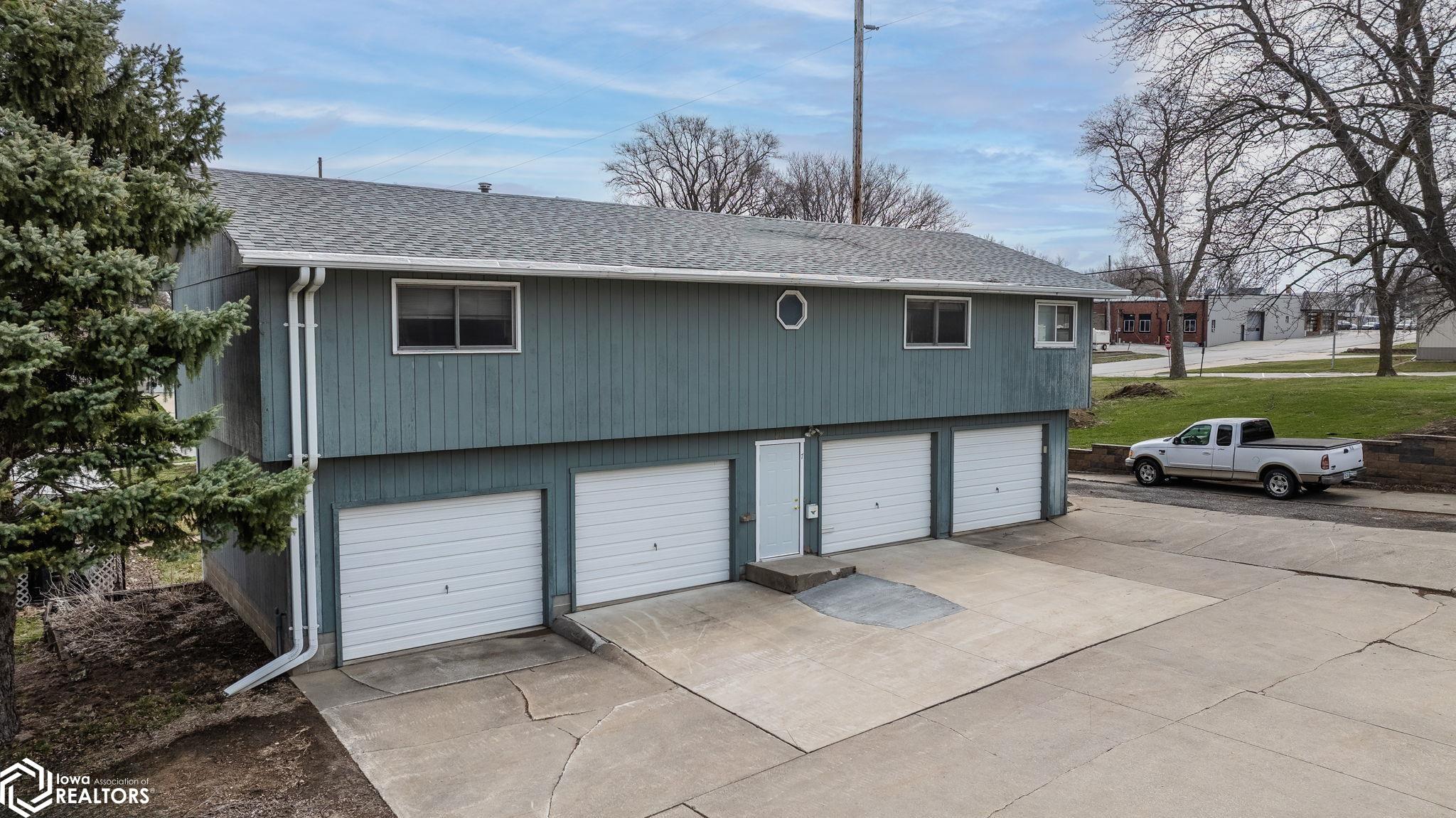 This has 4 garages on ground level and approx. 1,456 SF above which is a 2 bedroom apartment.