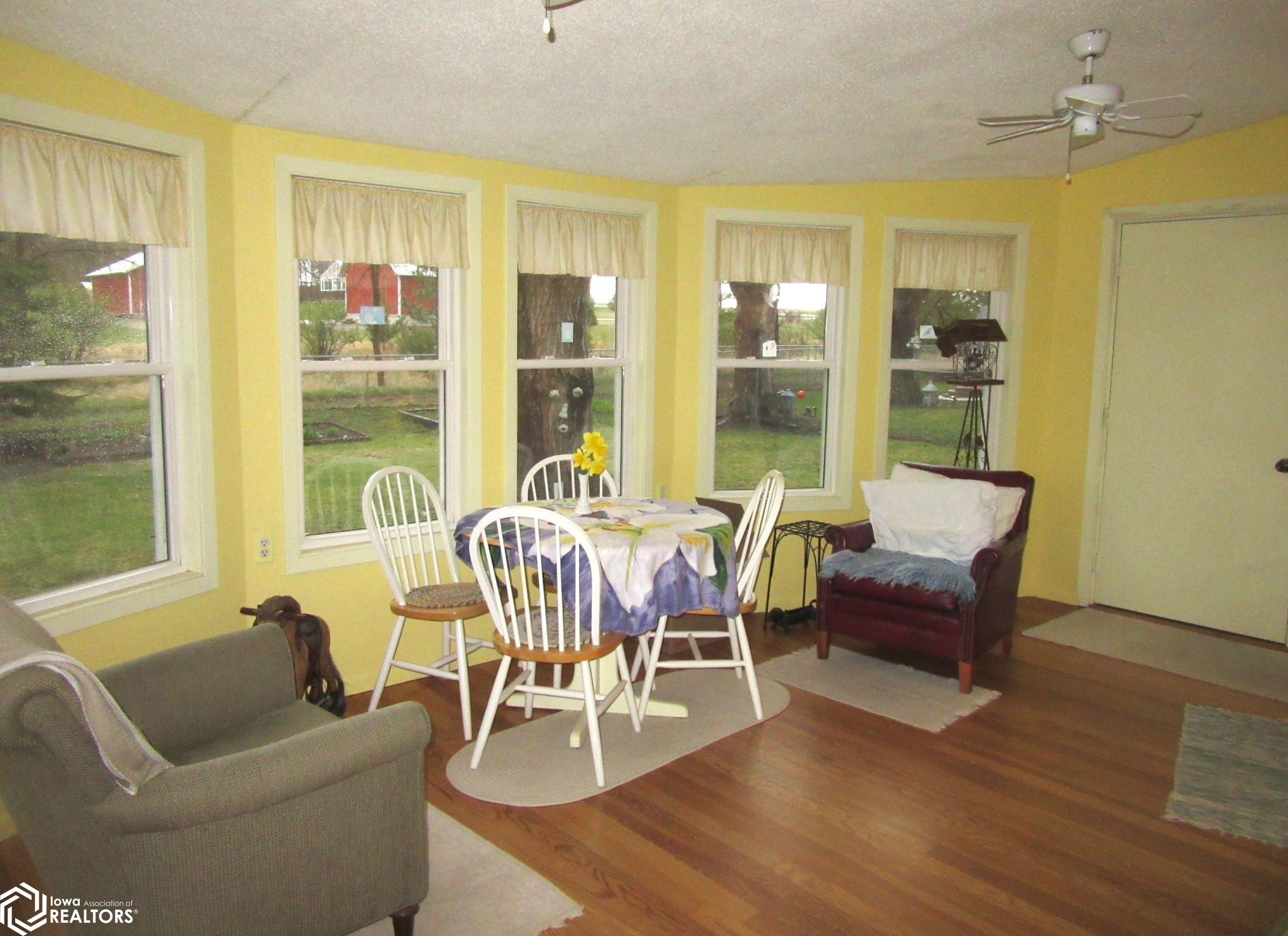 Spacious sun room with ample windows, access to back yard and also to double 