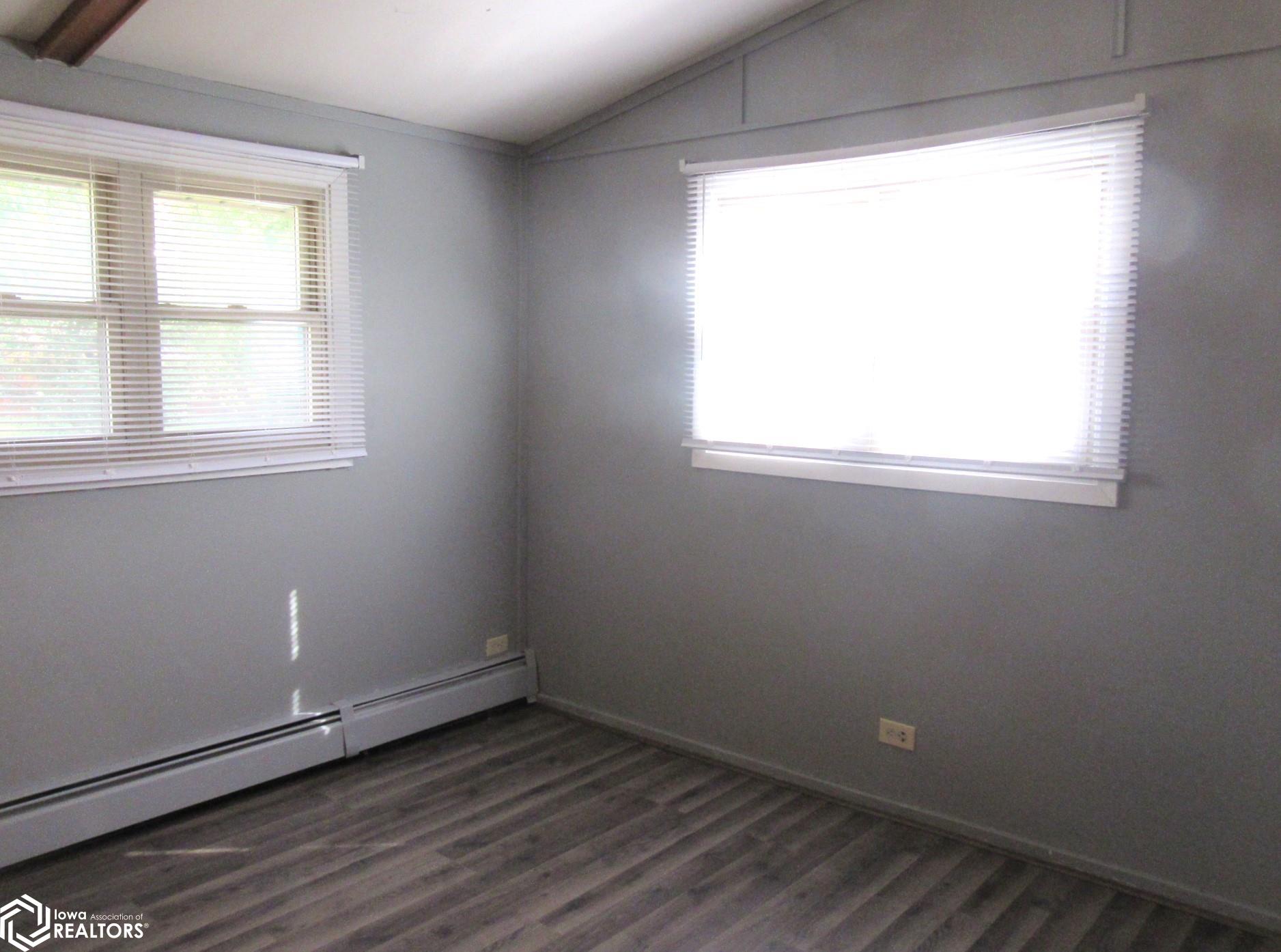 Main floor bedroom #2 with updated floors.  Closet and natural light