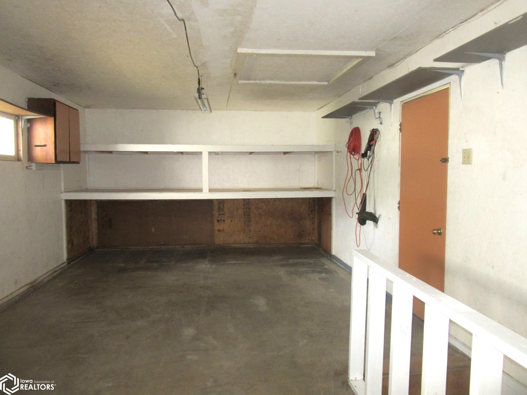 Extra Shelves up and our of the way for storage in the garage.  Also, Access door to the back yard!