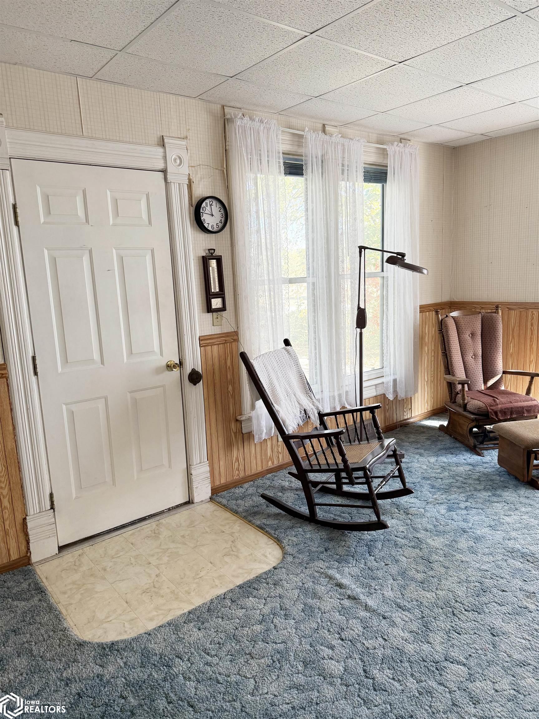 View of the living room looking North towards the front entrance door.