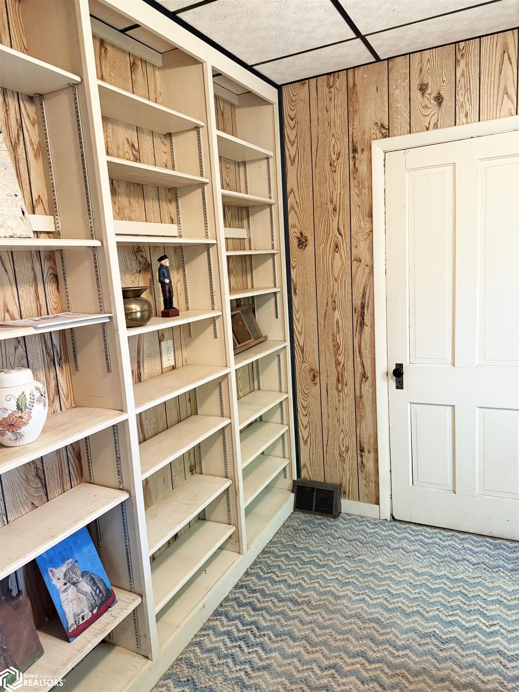 View of the main floor bedroom looking S towards the closet door.