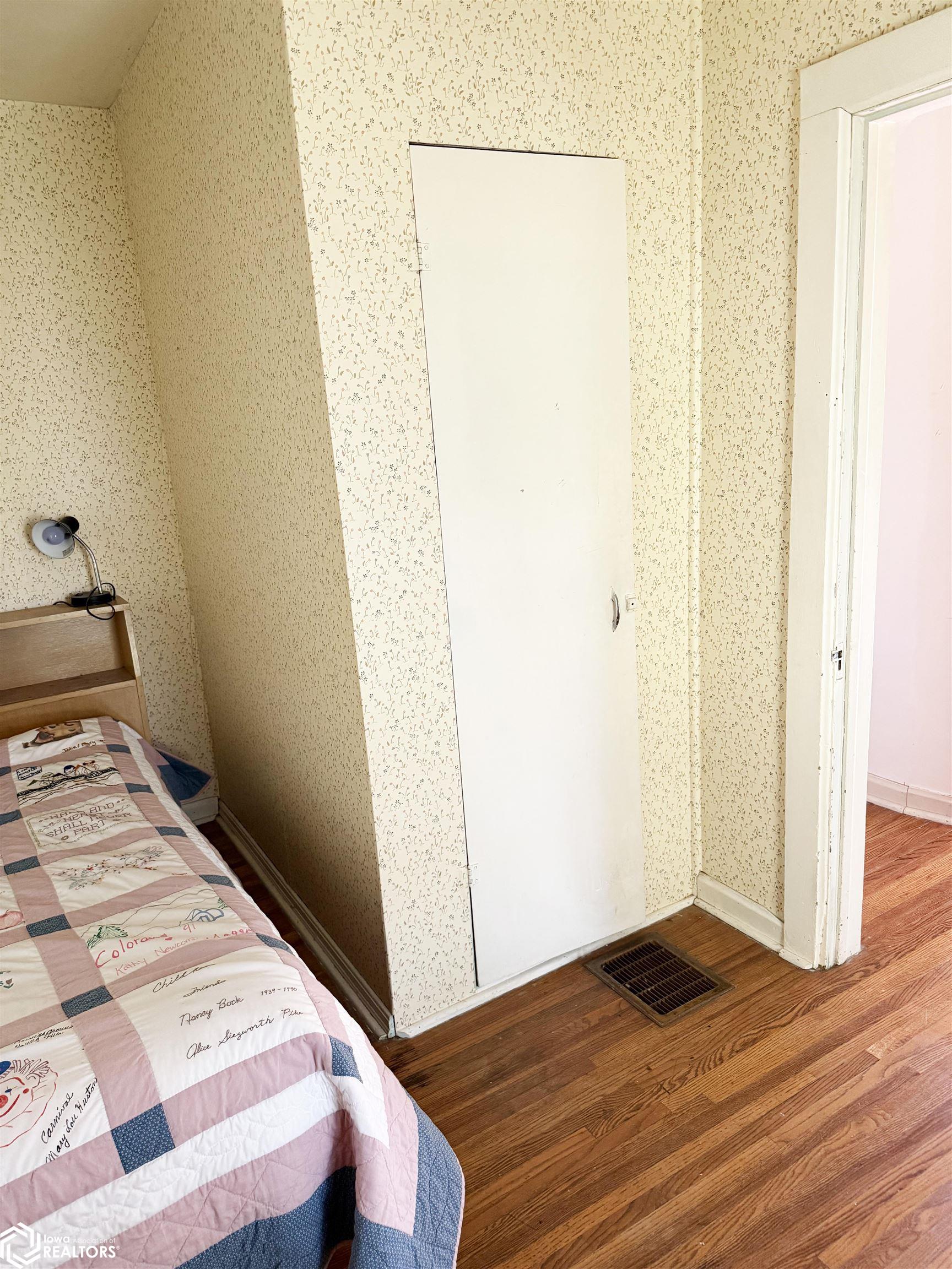 View of the large upstairs NW bedroom looking SE.