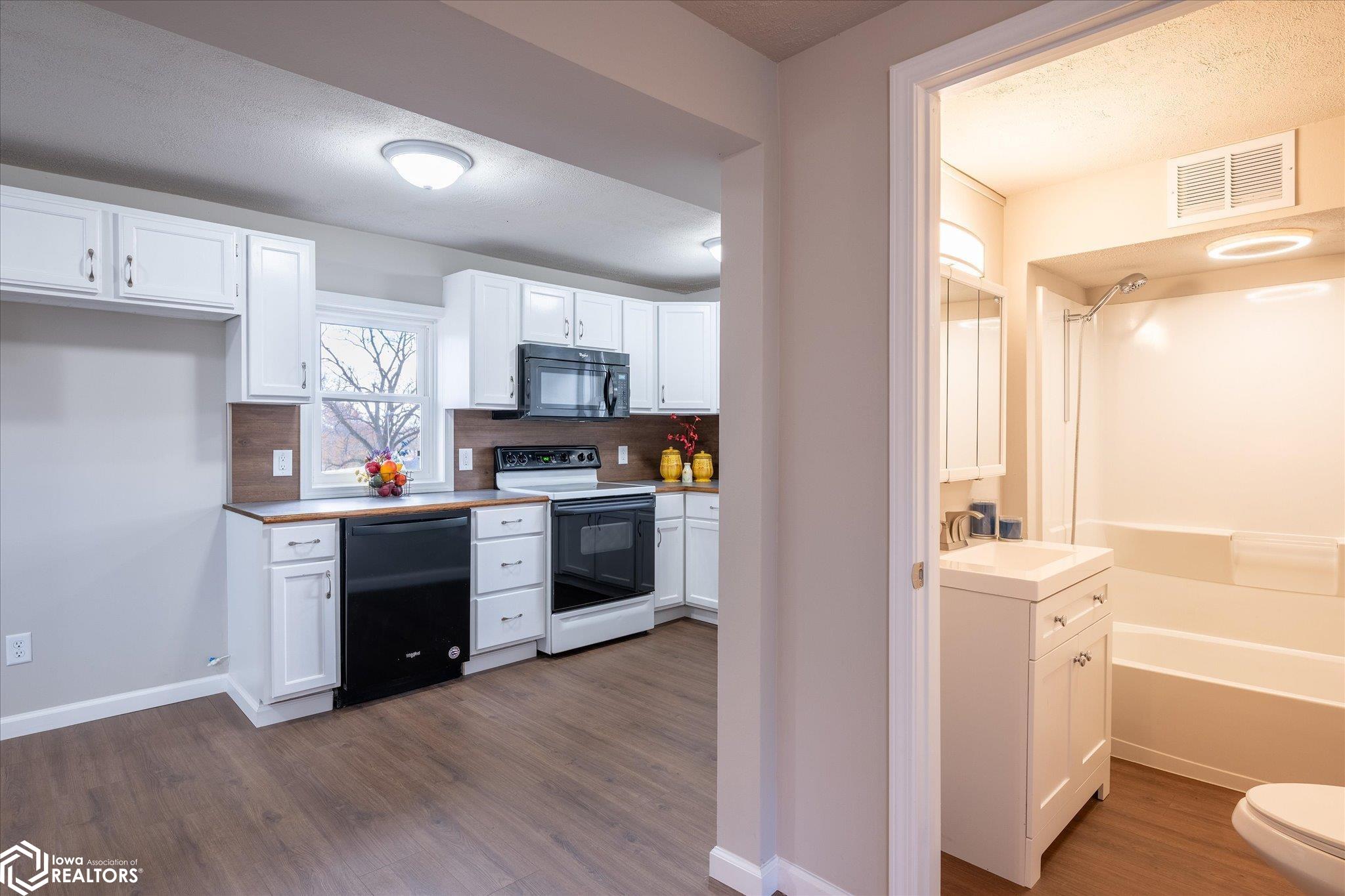 A bathroom with a tub is located on the main floor.