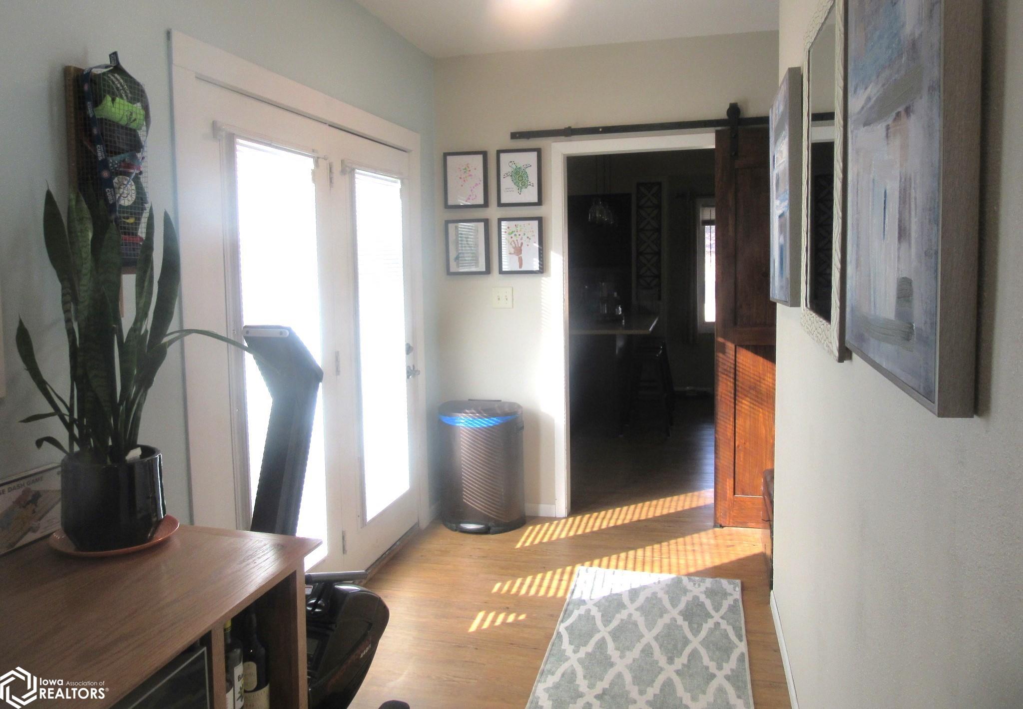 Back Entry.  Room for storage, coats, Washer/Dryer hook up.  Patio Door to the deck.   Barn Door into the kitchen.  Very functional space!