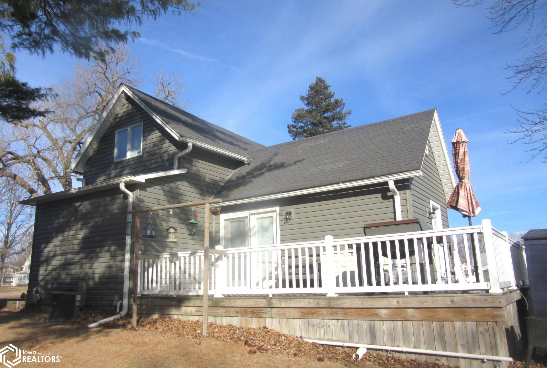 South side of property.   Deck for grilling and access to back door.