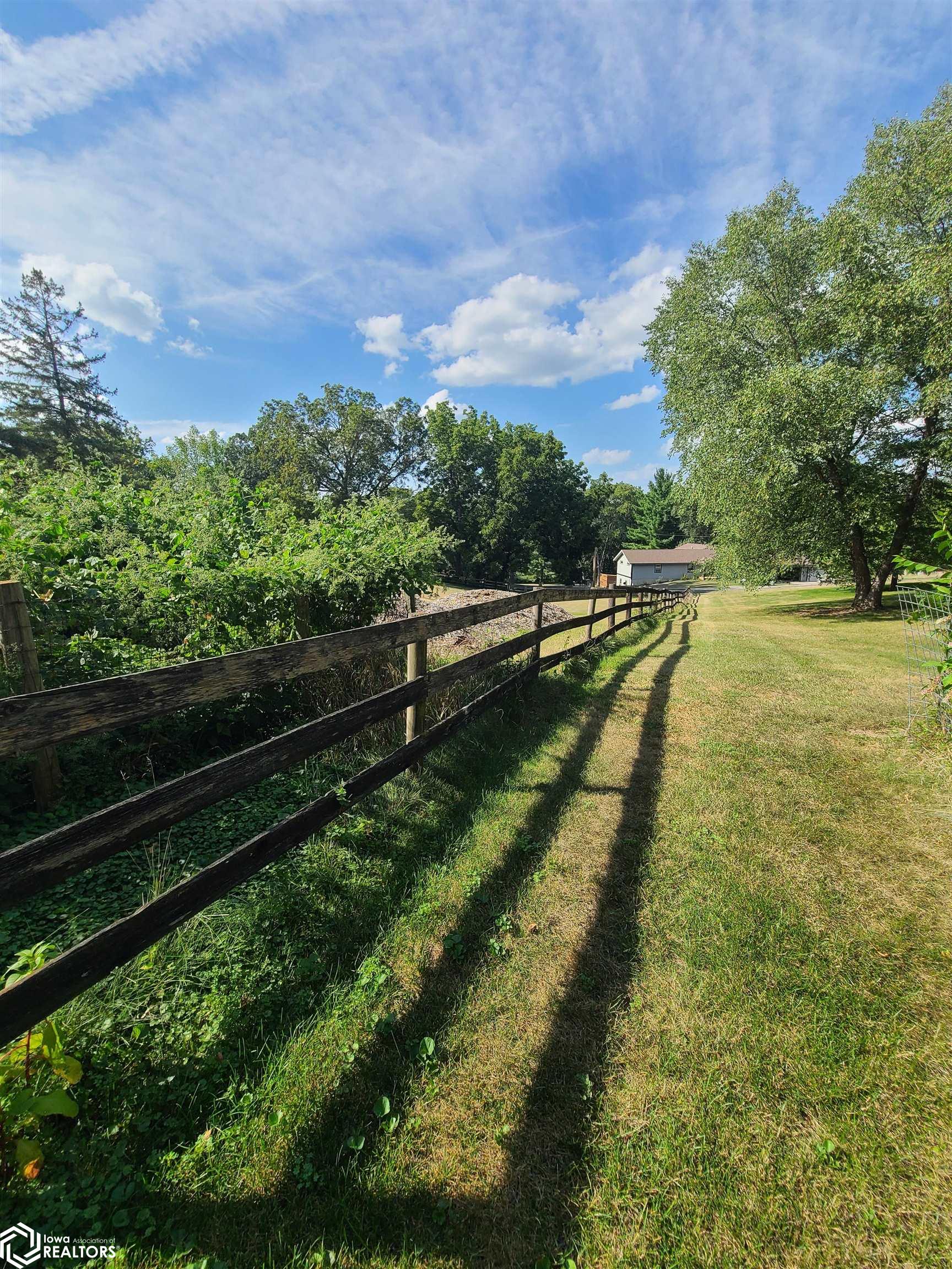 Fence runs North and South along East edge of Lot