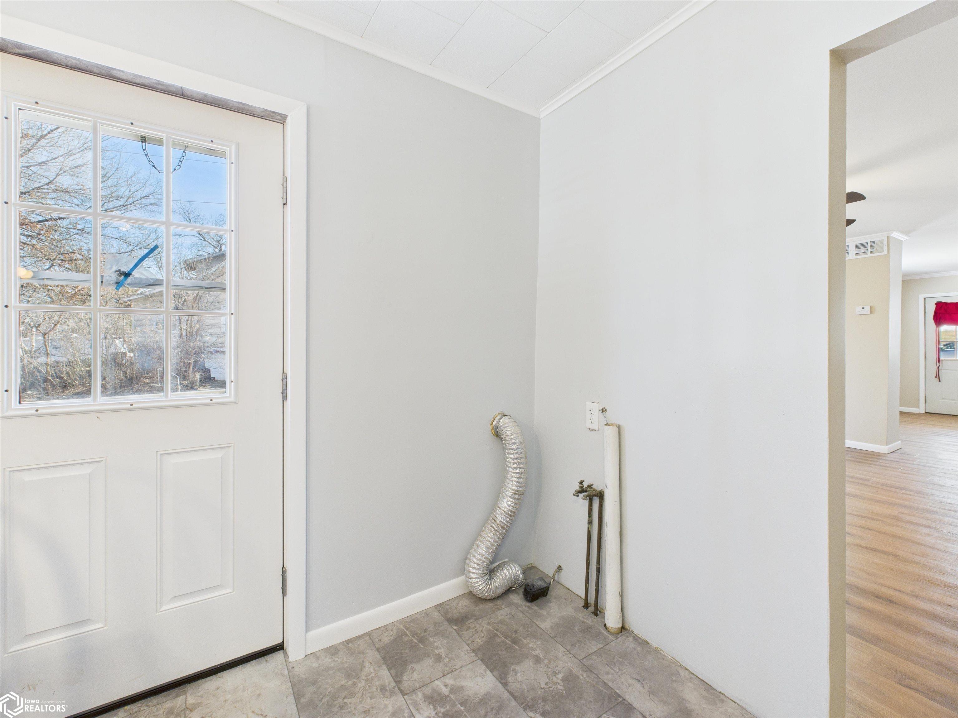 Hookups are in the kitchen. Door to side porch.