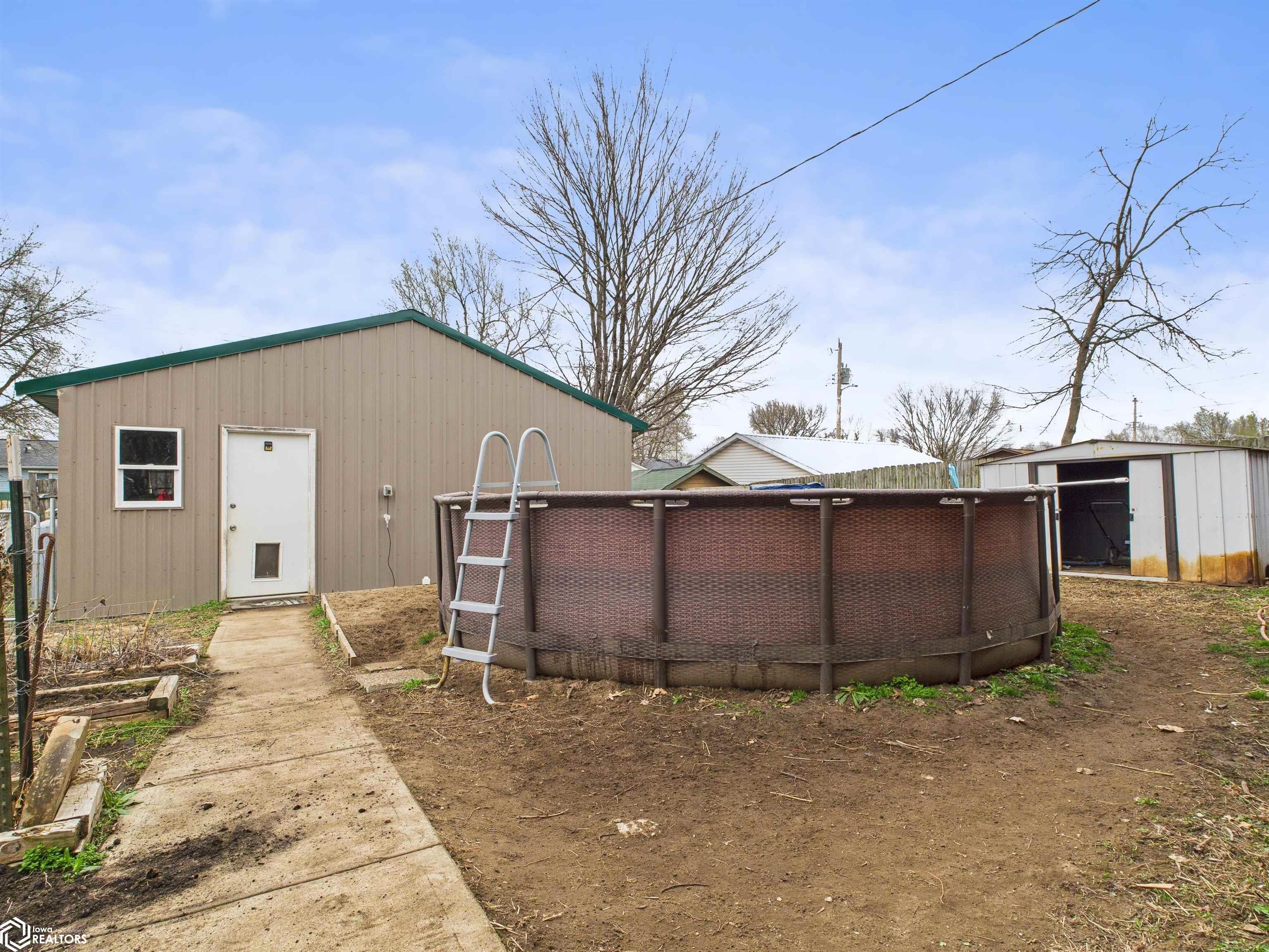 View of Pool in back yard toward Garage