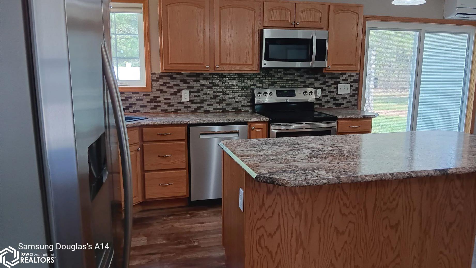 Large open Kitchen with Island and dining area flowing into the Living Room
