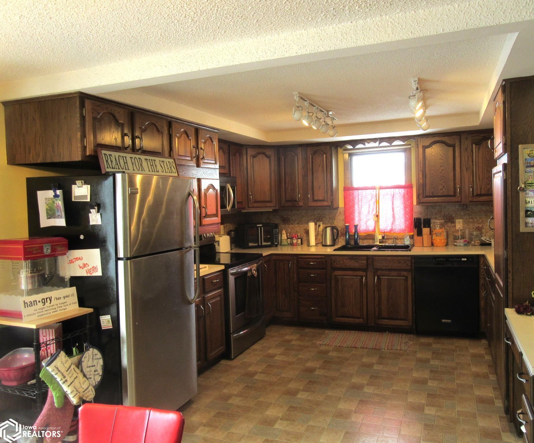 Oak kitchen with good counter space and window over the sink.