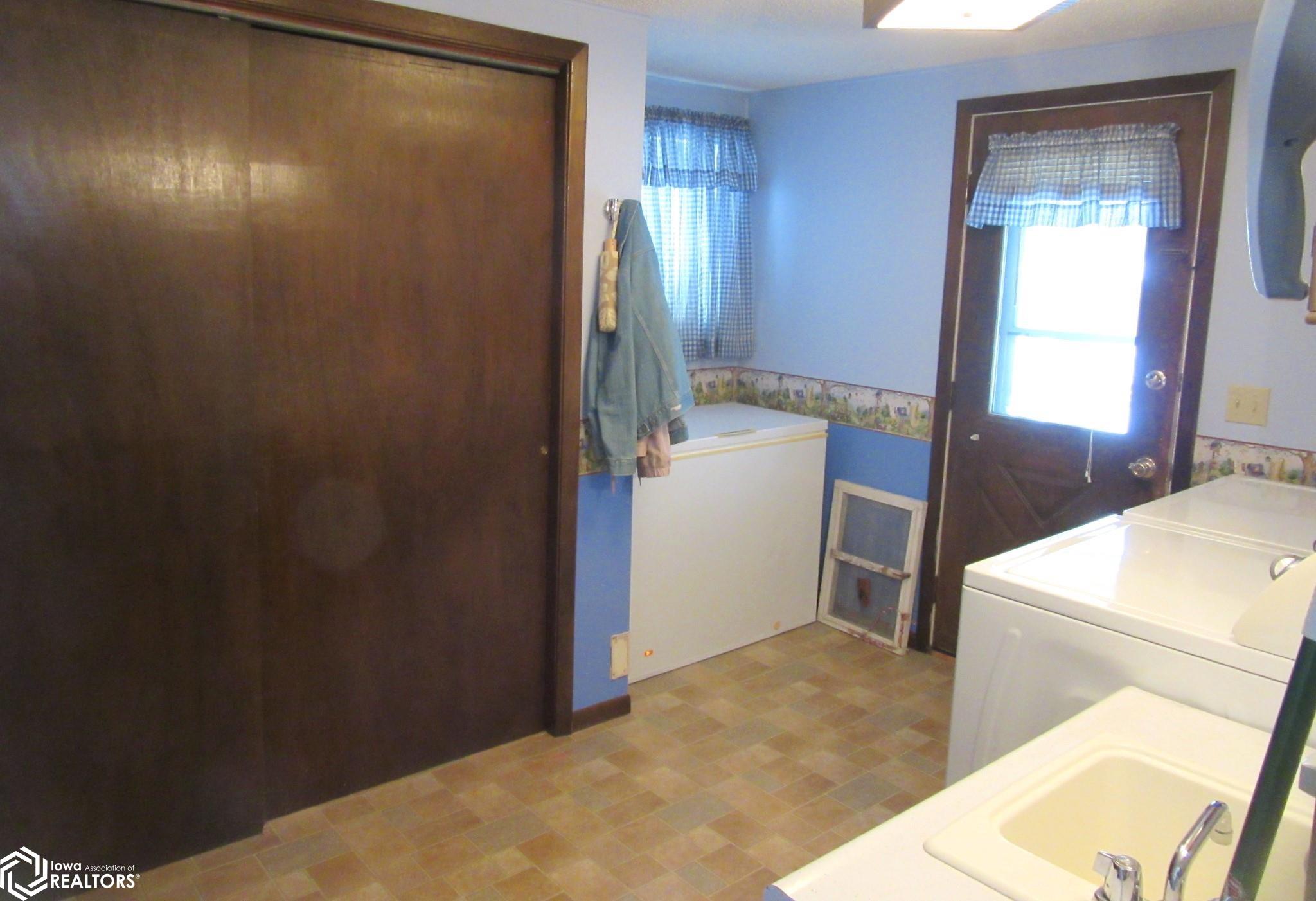 Spacious back entry with closet for coats, room for shoes and boots PLUS main floor laundry.  Very helpful for the busy family.   This entry does lead to a Screened Porch that overlooks the yard.