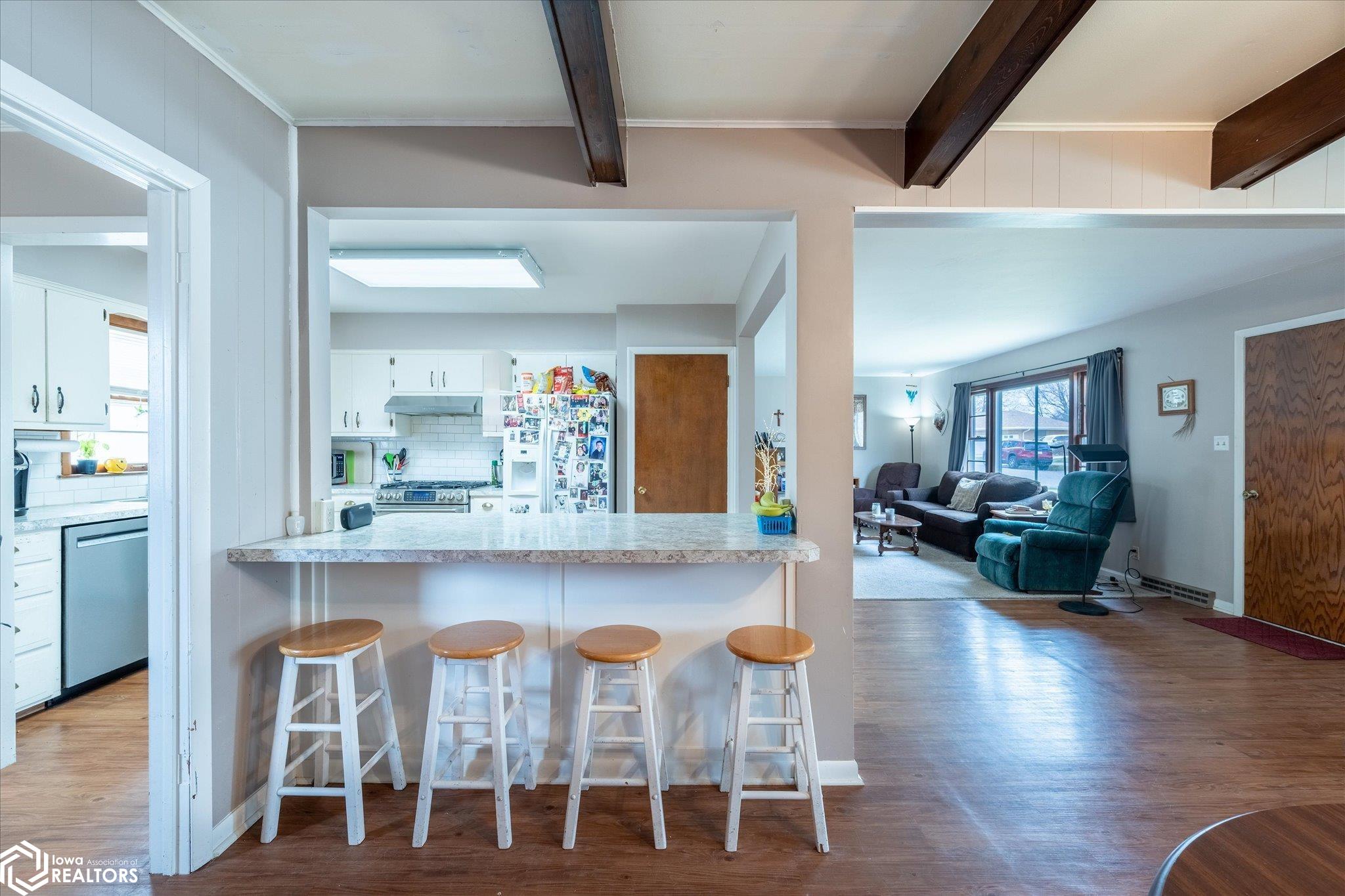 Looking West into the kitchen from the dining room.