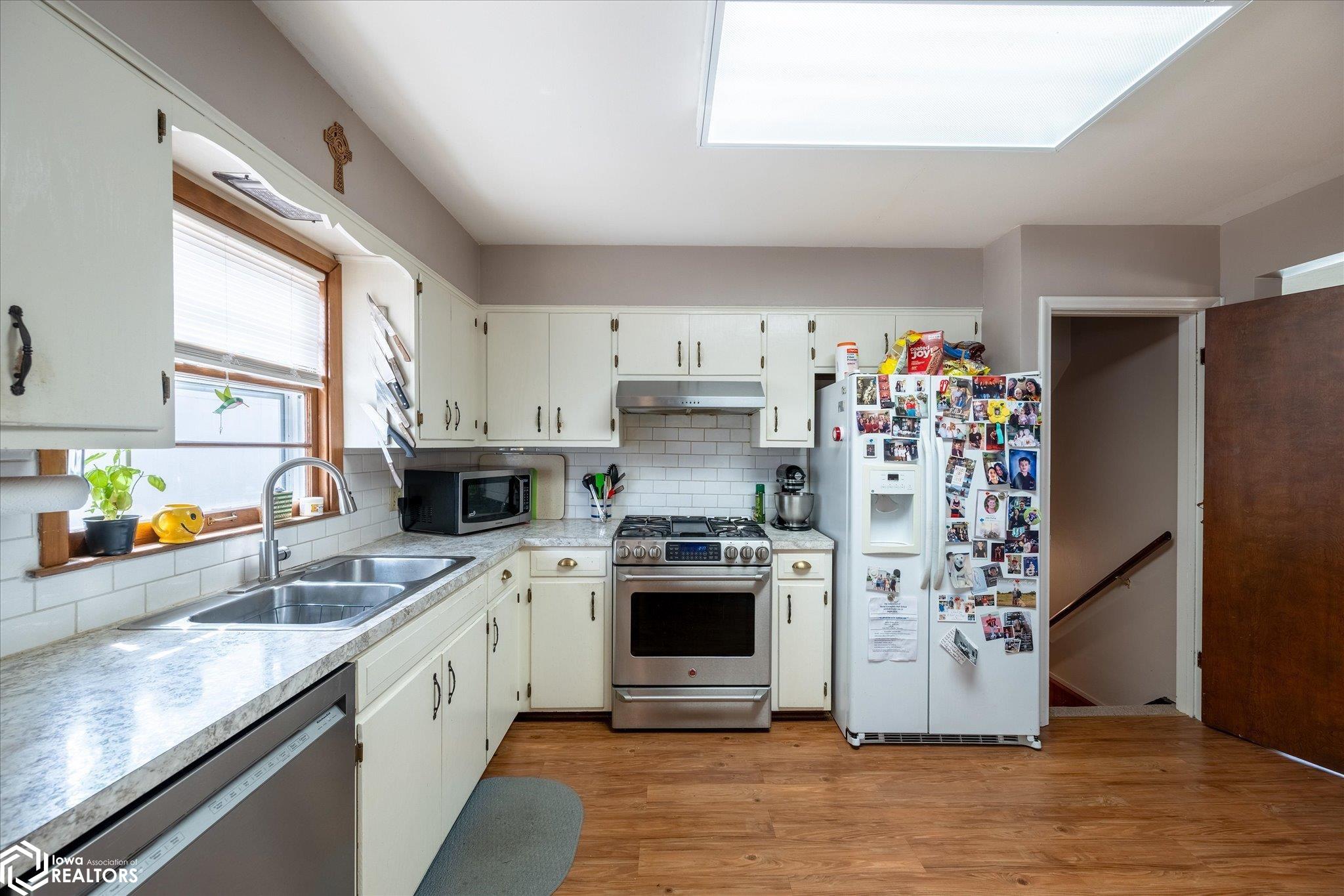 Looking West into the kitchen.