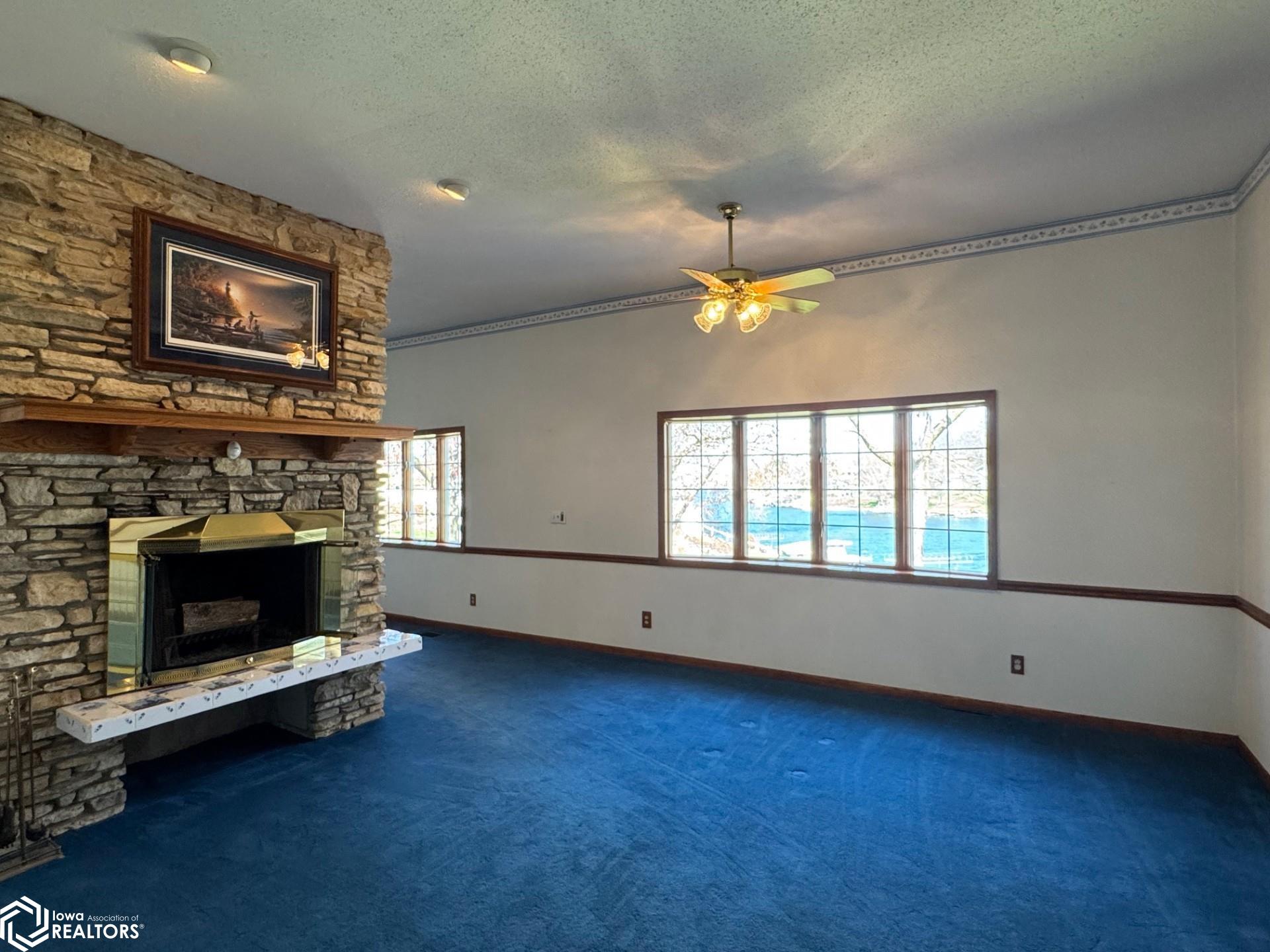 Fireplace from the original cabin located separating the dining room and living room.