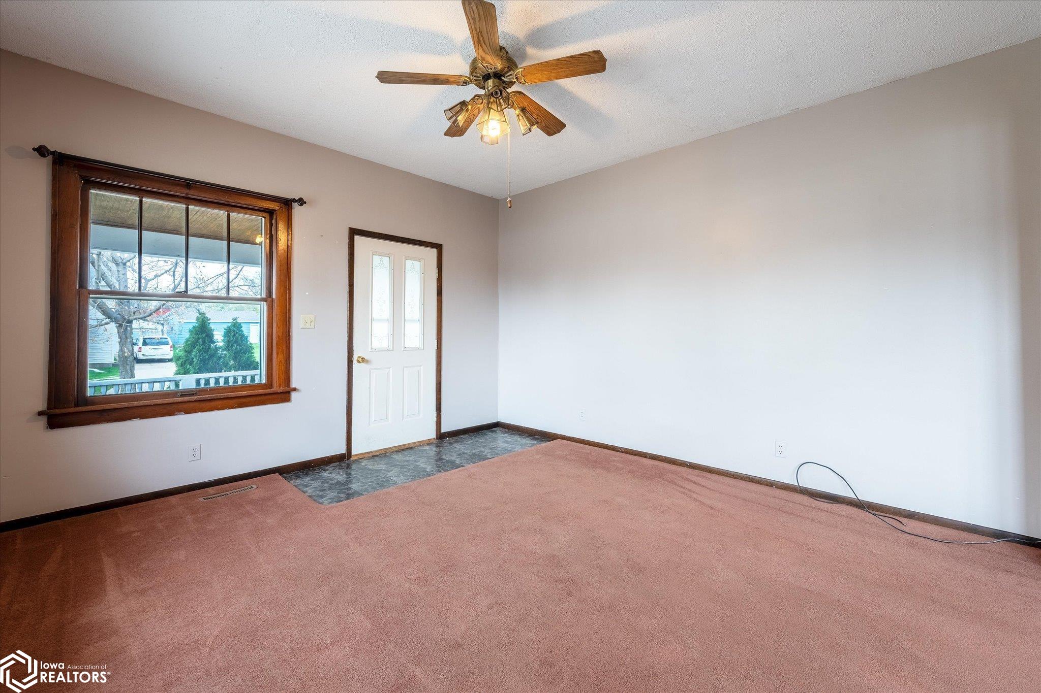 Looking South at the front door in the main level living room.