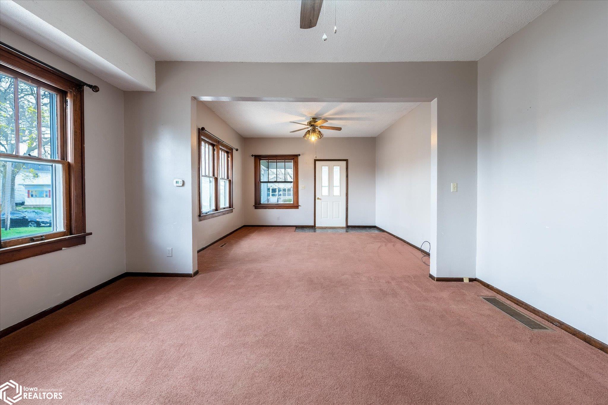 Looking South into both the living and dining rooms.