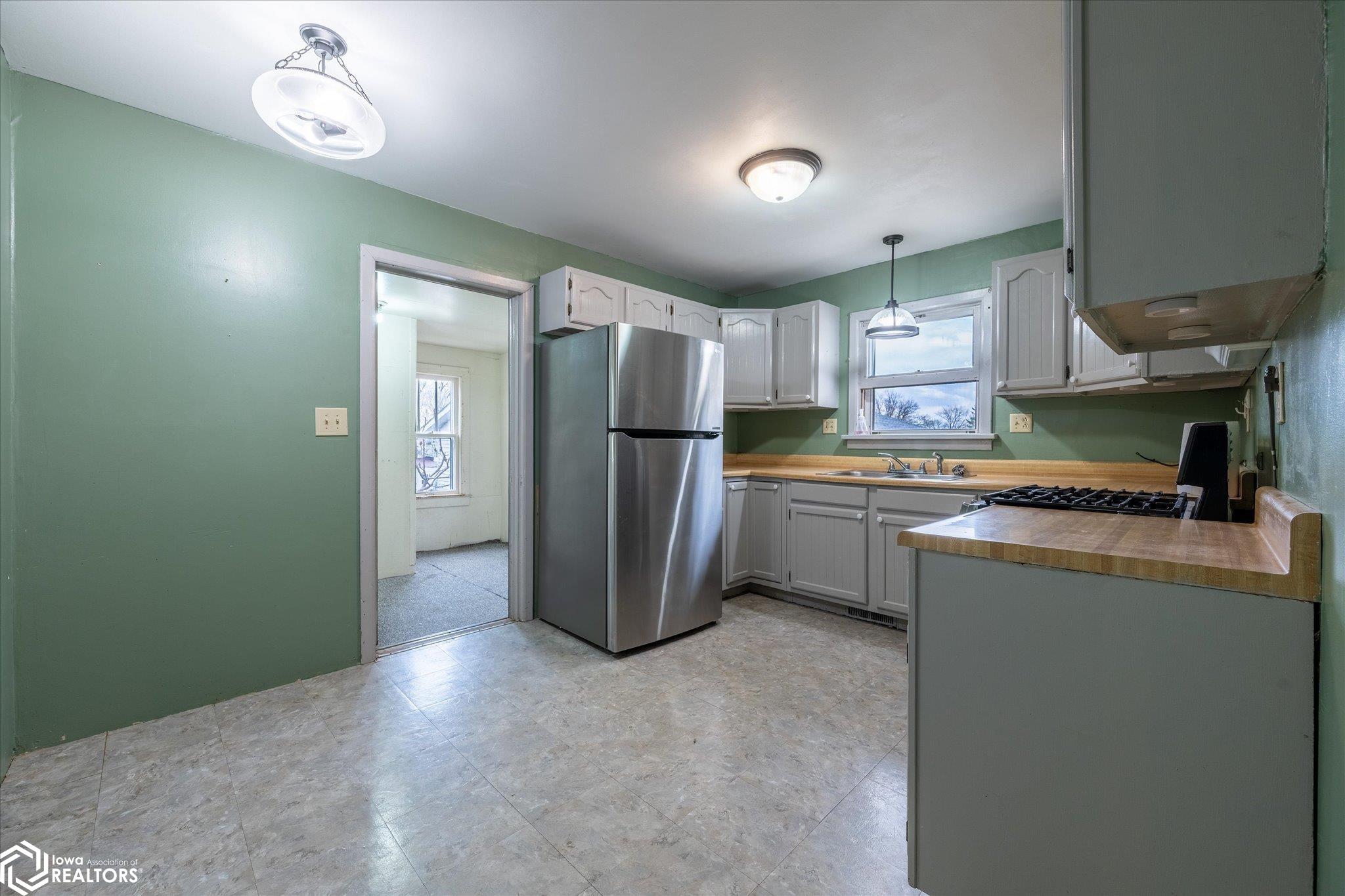 Looking NE into the main level kitchen.